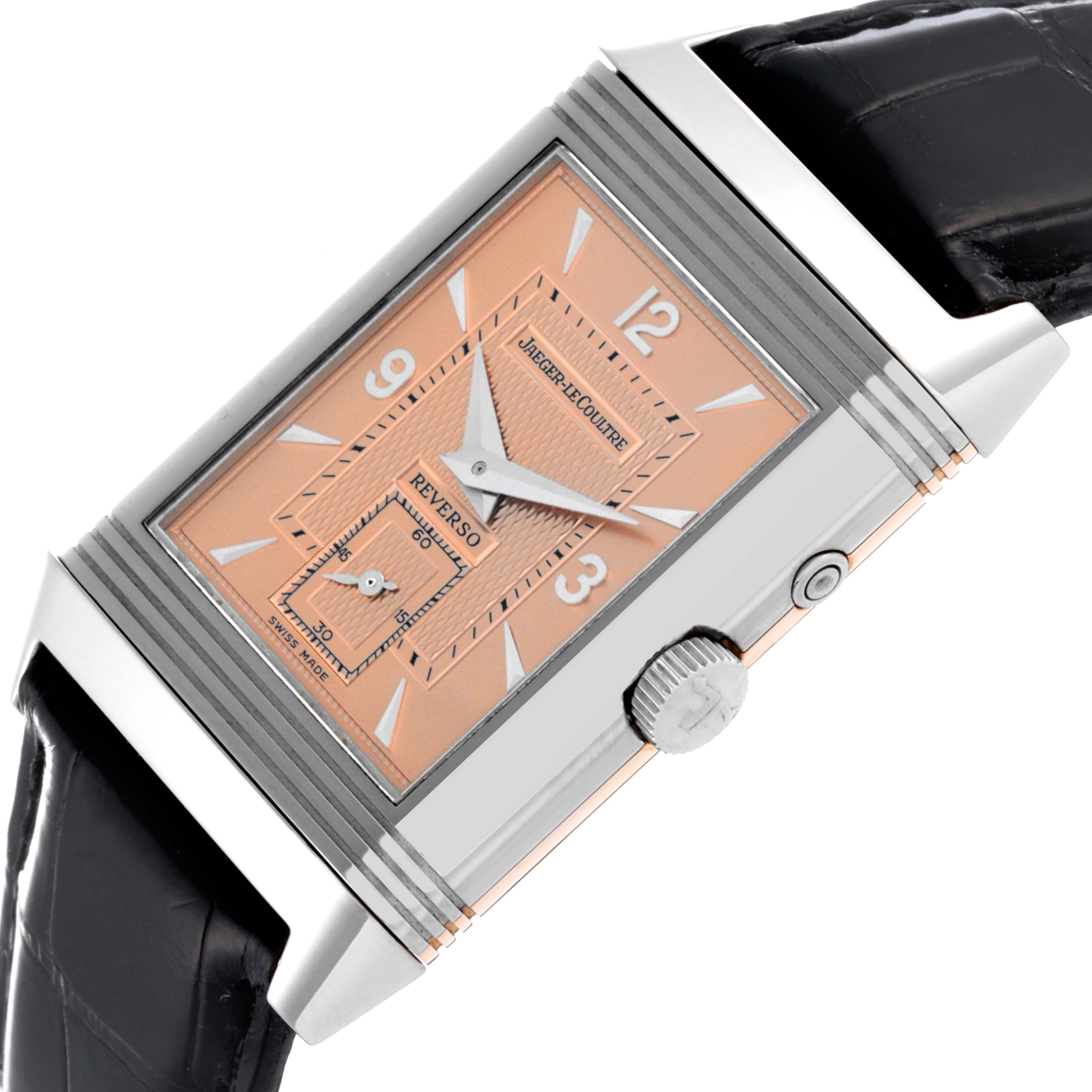 The Jaeger-LeCoultre Reverso watch is shown at an angle highlighting its face, case, crown, and black strap.