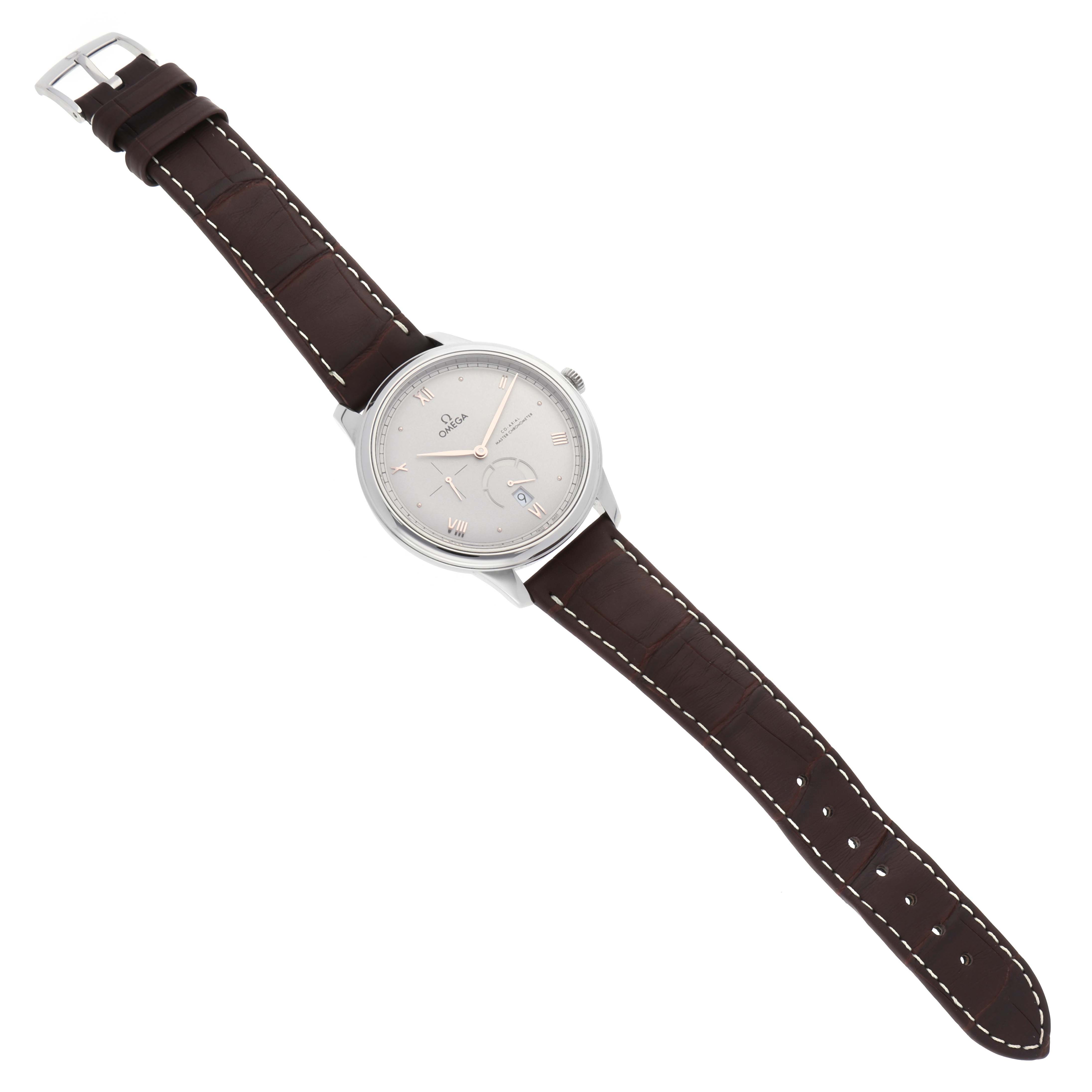 The image shows an Omega De Ville 434.13.41.21.06.001 Men's Stainless Steel Grey Dial 434.13.41.21.06.001 Men's Stainless Steel Grey Dial watch from a top-down angle, highlighting the watch face and brown leather strap.