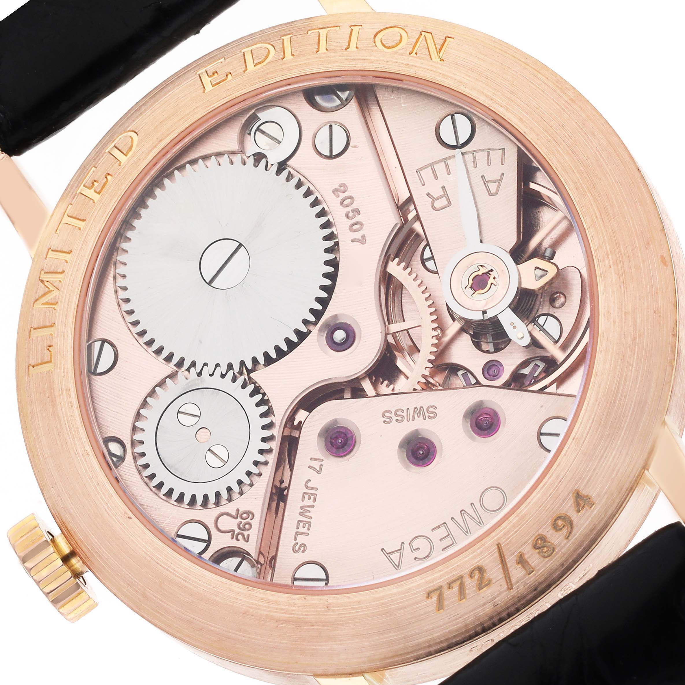 The image shows the back of the Omega Museum 5950.30.03 Men's Rose Gold Champagne Dial 5950.30.03 Men's Rose Gold Champagne Dial model watch, revealing its mechanical movement and gears.