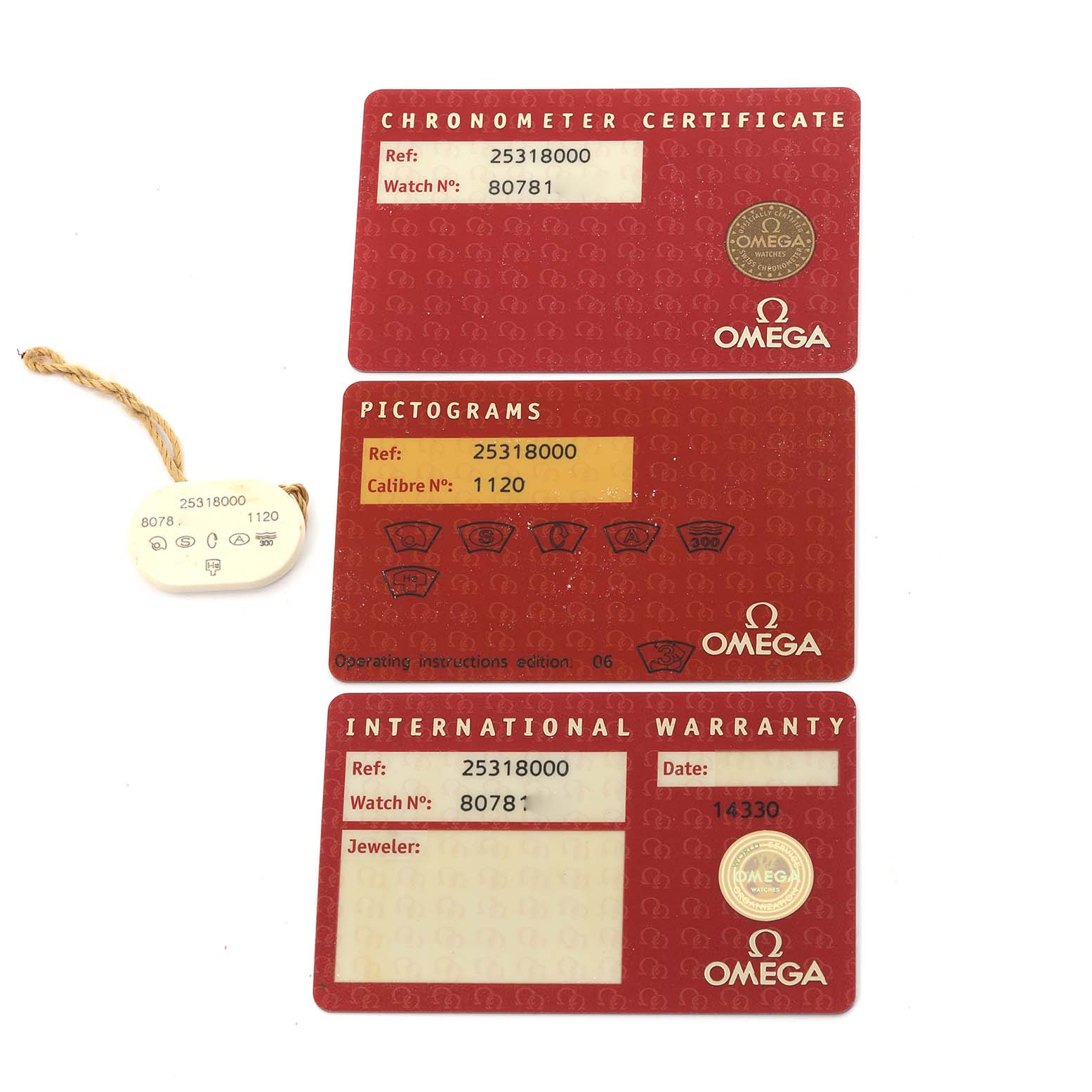 The image shows red Omega cards for the Seamaster model with a chronometer certificate, pictograms, and international warranty.