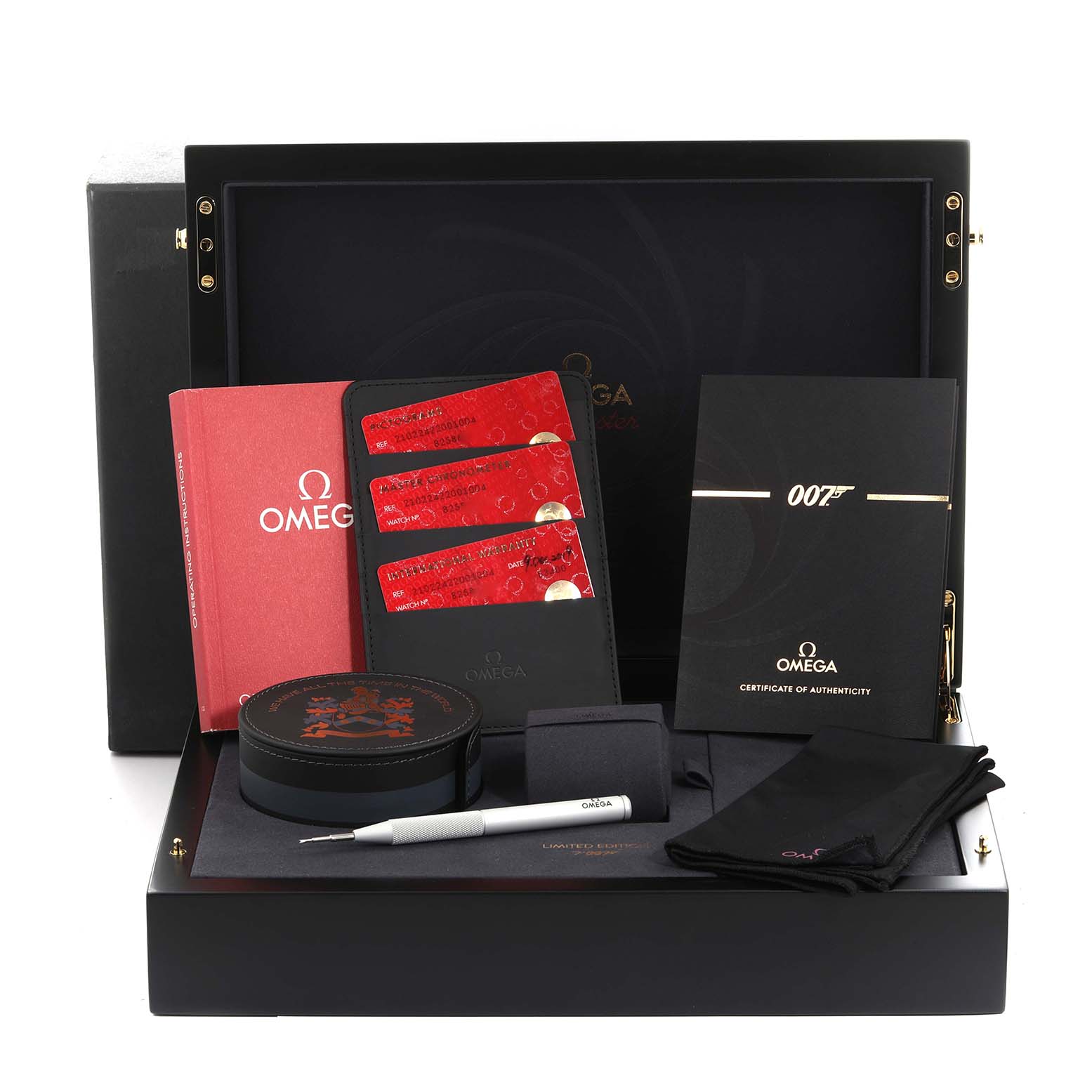 The image shows an Omega Seamaster 210.22.42.20.01.004 Men's Stainless Steel Black Dial 210.22.42.20.01.004 Men's Stainless Steel Black Dial box set with cards, booklets, a tool, and accessories from a top-down angle.