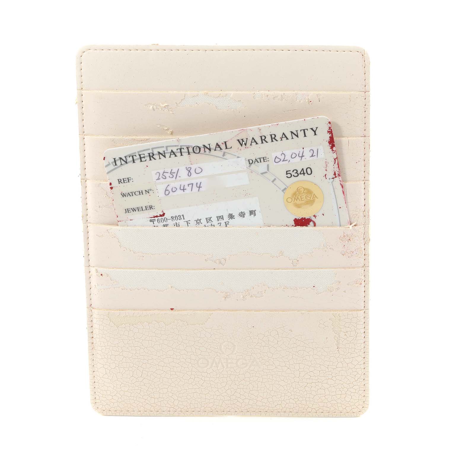 The image shows an Omega Seamaster 2551.80.00 Men's Stainless Steel Blue Dial 2551.80.00 Men's Stainless Steel Blue Dial International Warranty card holder from a top view.