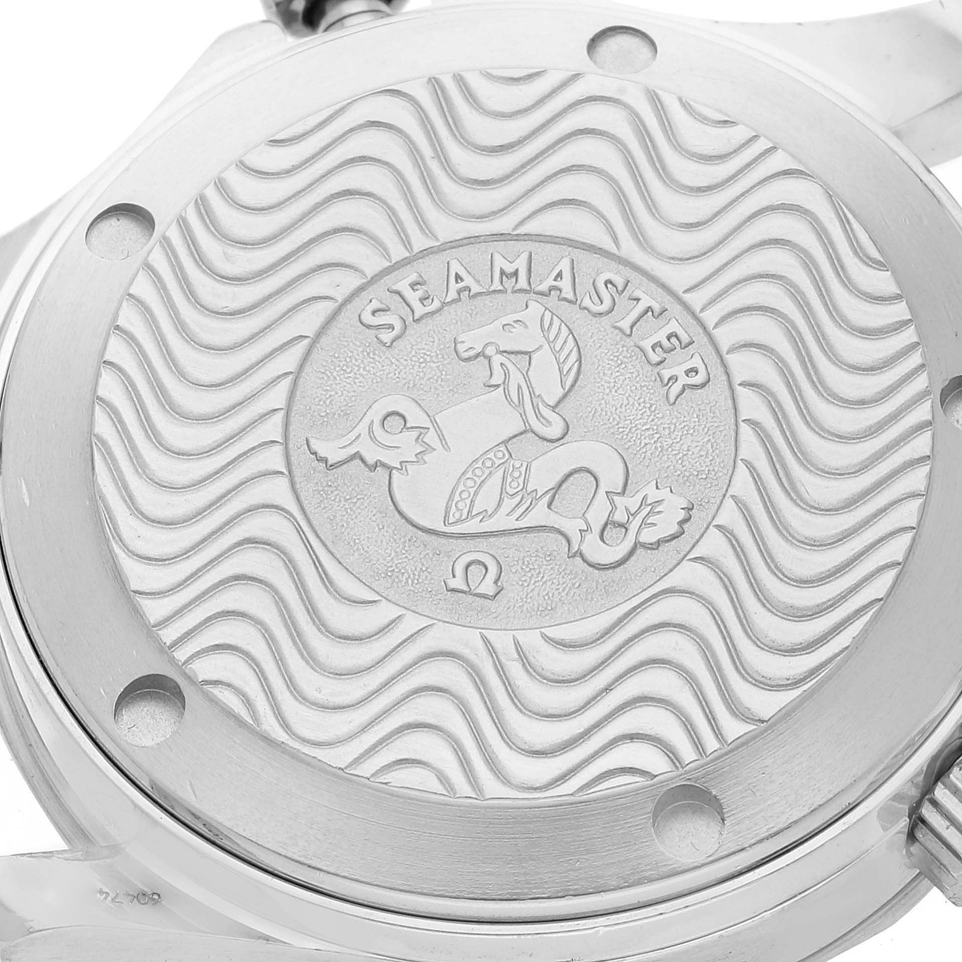 The image shows the case back of the Omega Seamaster 2551.80.00 Men's Stainless Steel Blue Dial 2551.80.00 Men's Stainless Steel Blue Dial watch with its engraved logo and wavy design.