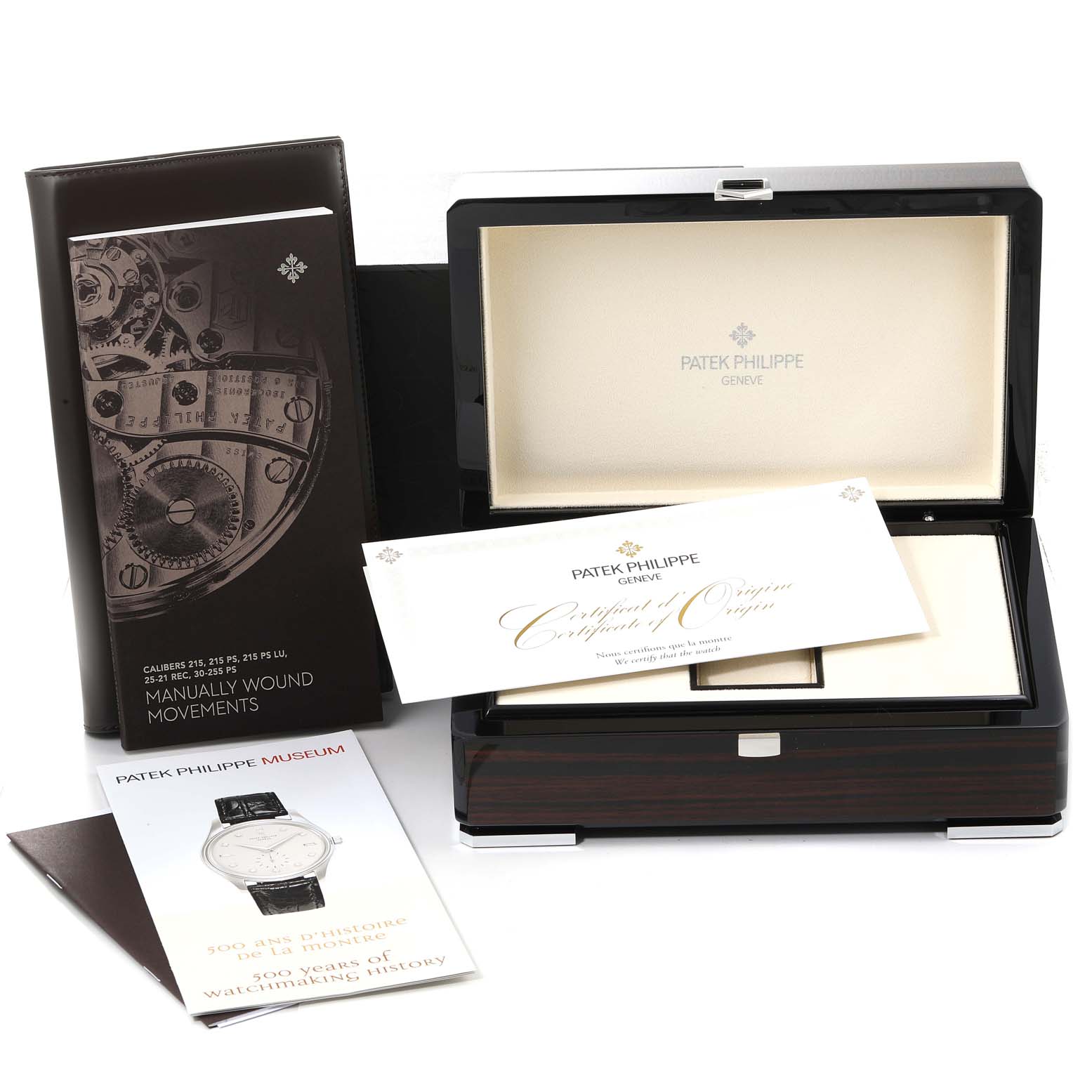 The image shows a Patek Philippe Calatrava 5196G Men's White Gold Silver Dial 5196G Men's White Gold Silver Dial watch box, certificate of origin, manual, and a brochure.