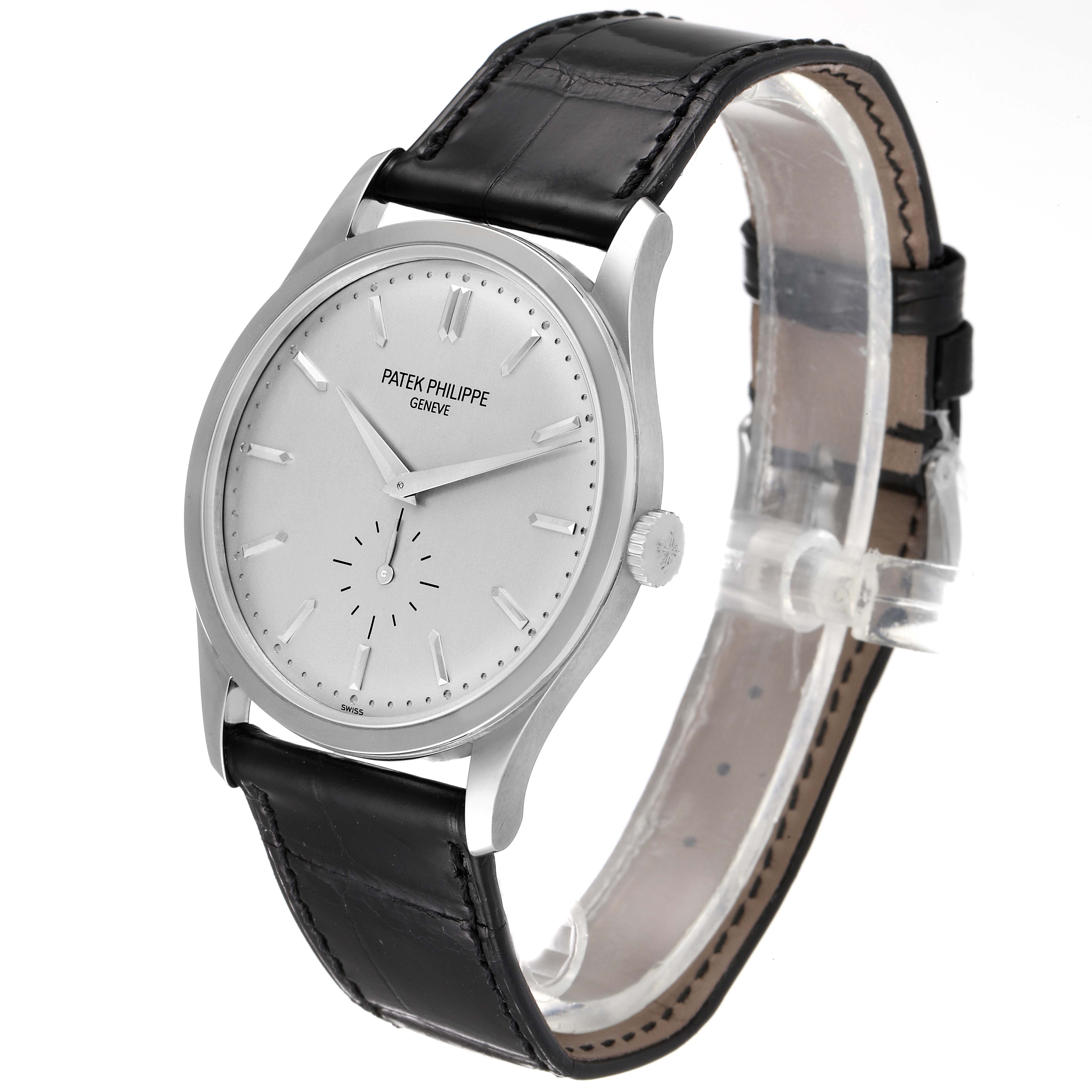 The image shows a side and partial top view of the Patek Philippe Calatrava 5196G Men's White Gold Silver Dial 5196G Men's White Gold Silver Dial watch, highlighting its dial, bezel, and leather strap.