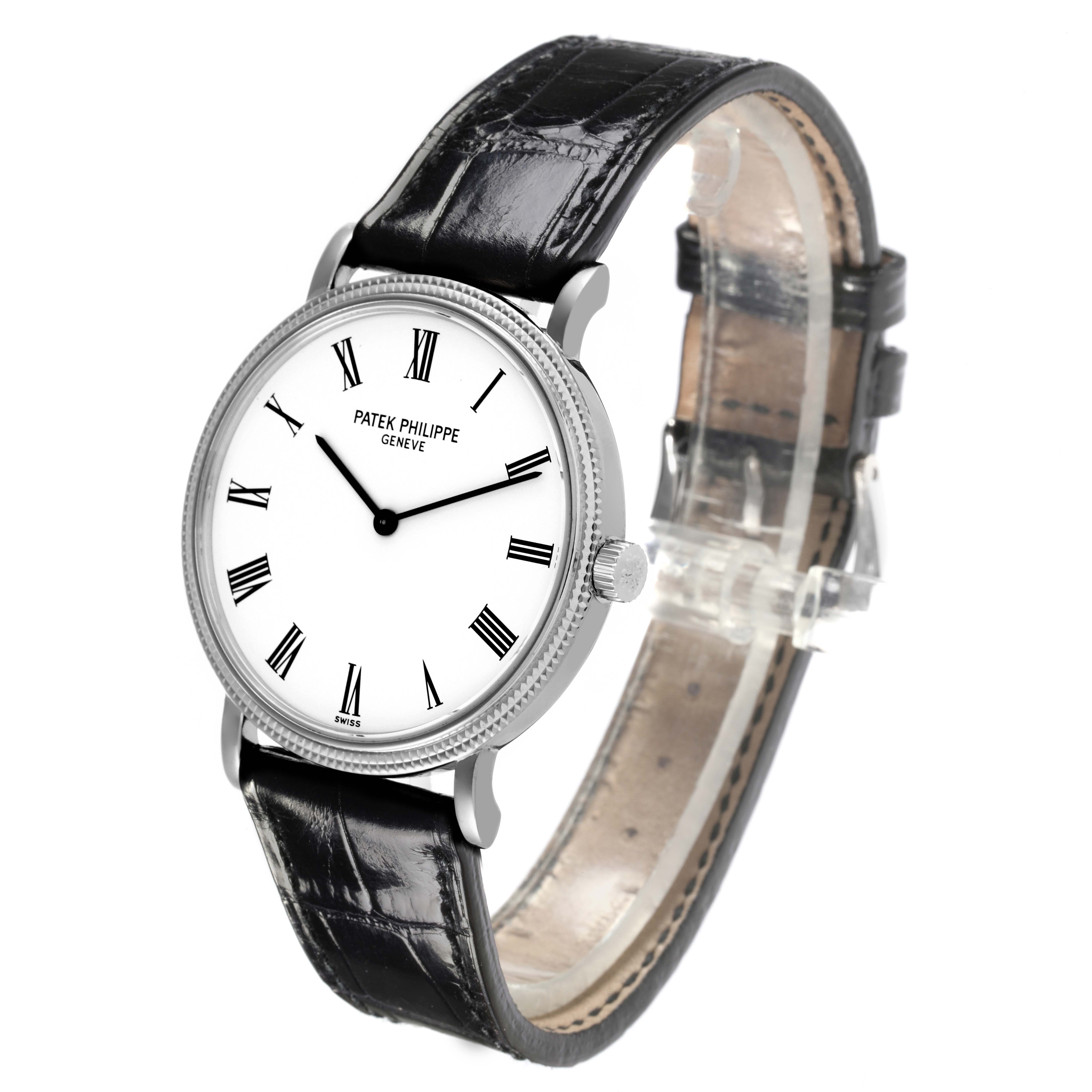 The Patek Philippe Calatrava 5120G-001 Men's White Gold White Dial 5120G-001 Men's White Gold White Dial watch is shown at a slight angle, displaying the face, bezel, crown, and leather strap.