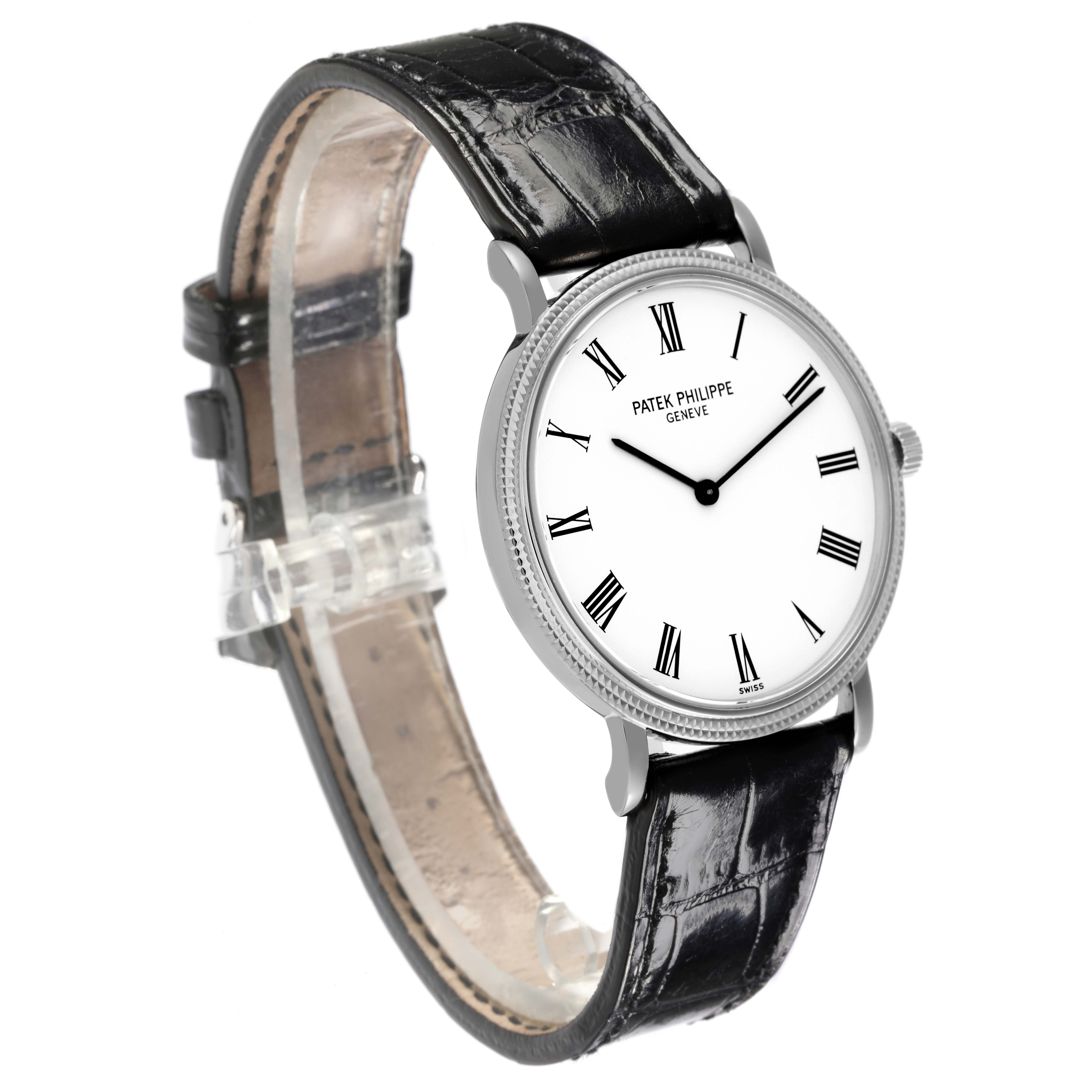 The Patek Philippe Calatrava 5120G-001 Men's White Gold White Dial 5120G-001 Men's White Gold White Dial watch is shown from an angled side view, displaying the face, bezel, crown, and leather strap.