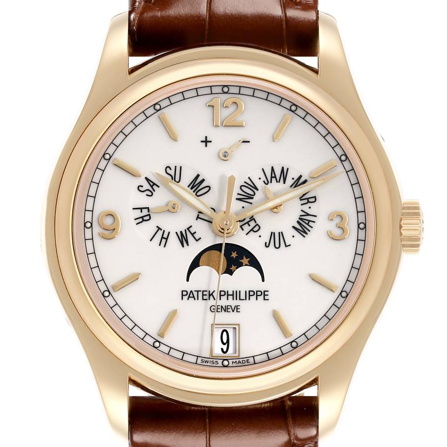 The Patek Philippe Complications watch is shown from a front angle, highlighting the dial with calendar and moon phase features.