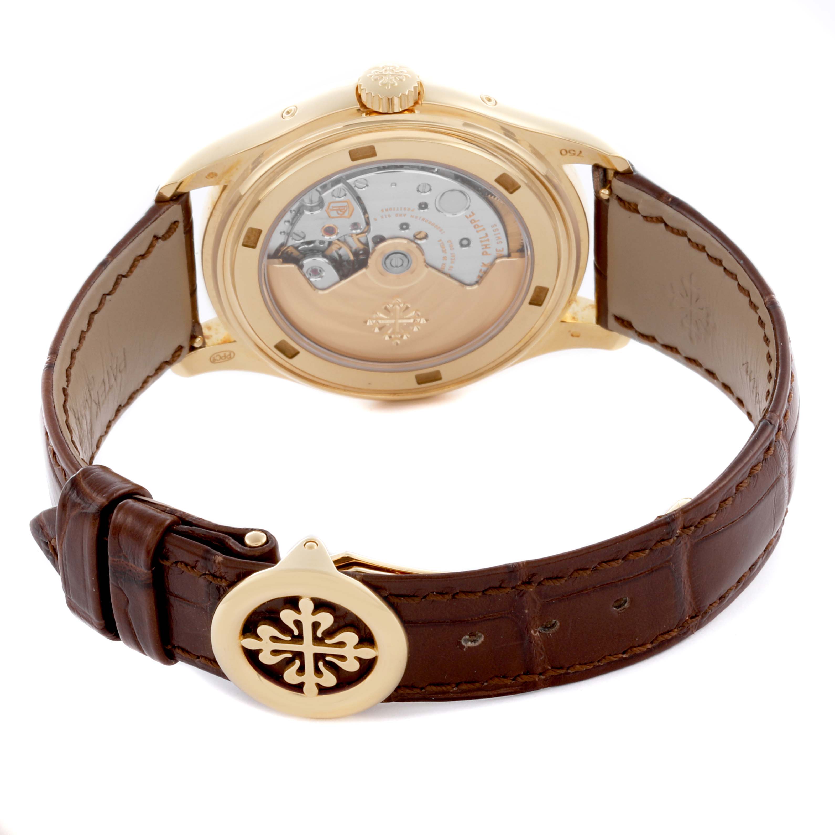 The Patek Philippe Complications 5146J-001 Men's Yellow Gold White Dial 5146J-001 Men's Yellow Gold White Dial watch is shown from the back, highlighting the movement and leather strap with a decorative clasp.