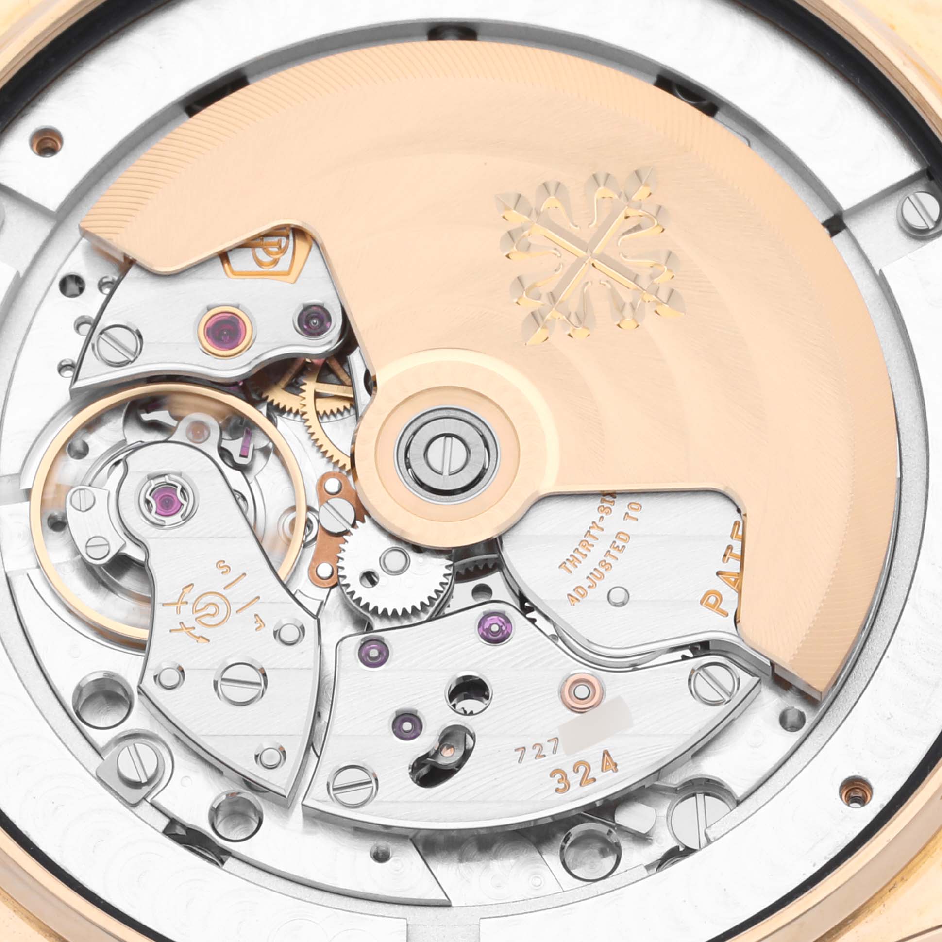 The image shows the movement and rotor of the Patek Philippe Complications 5146J-001 Men's Yellow Gold White Dial 5146J-001 Men's Yellow Gold White Dial watch from the back.