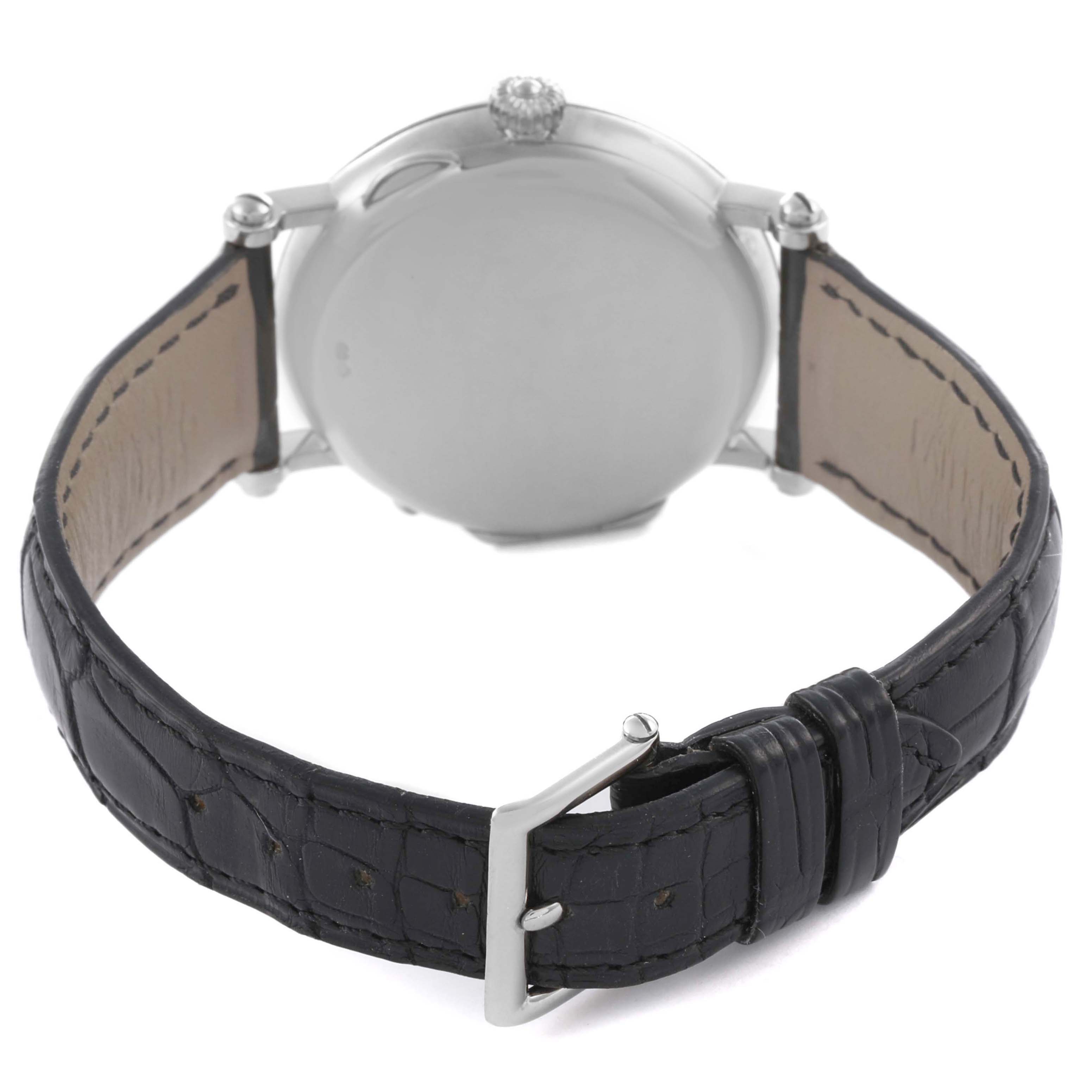 The image shows the back view of the Patek Philippe Complications 5015G Men's White Gold White Dial watch, focusing on the case back, lugs, and leather strap with a buckle.