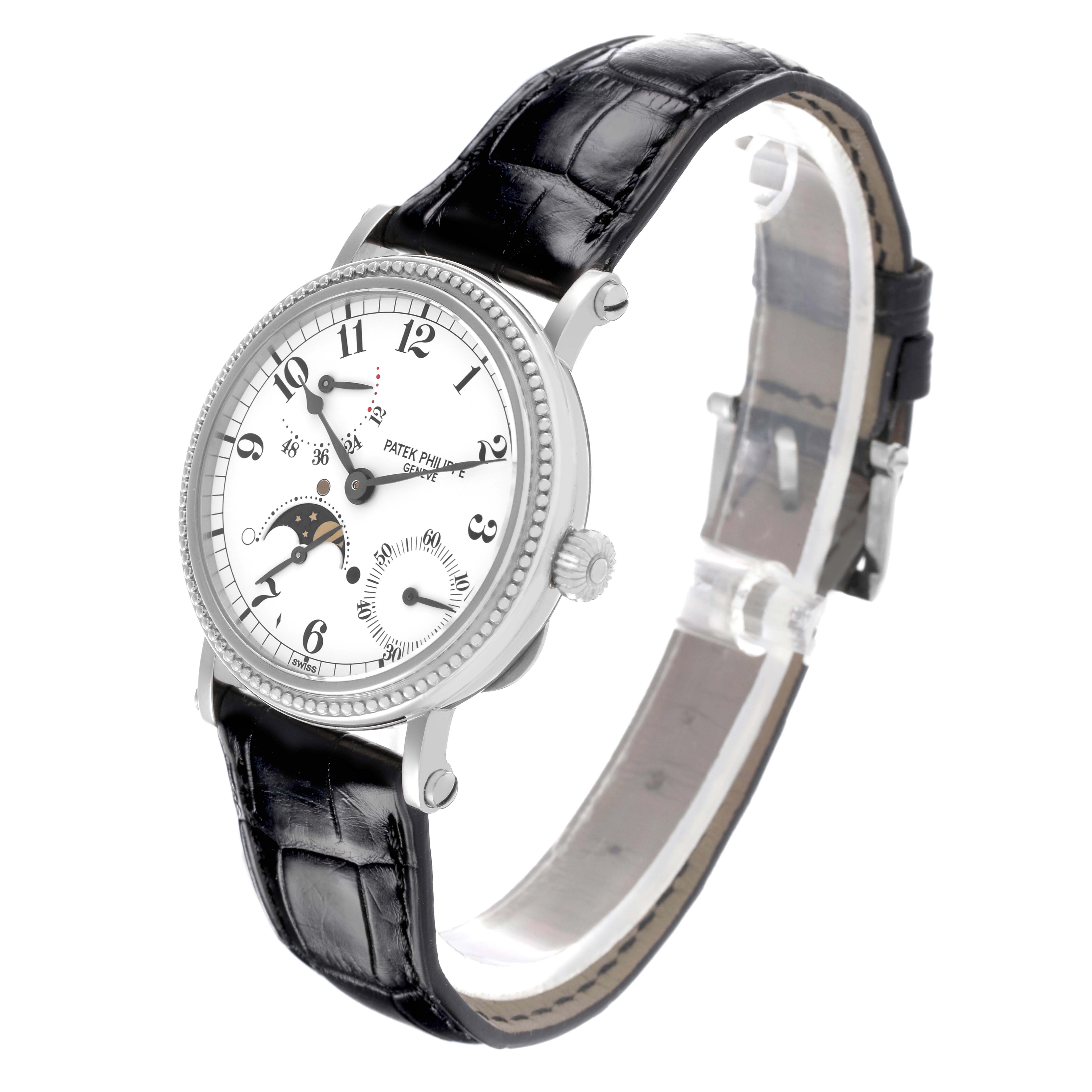 The Patek Philippe Complications 5015G Men's White Gold White Dial watch is shown at an angled view, displaying the face, bezel, and leather strap.