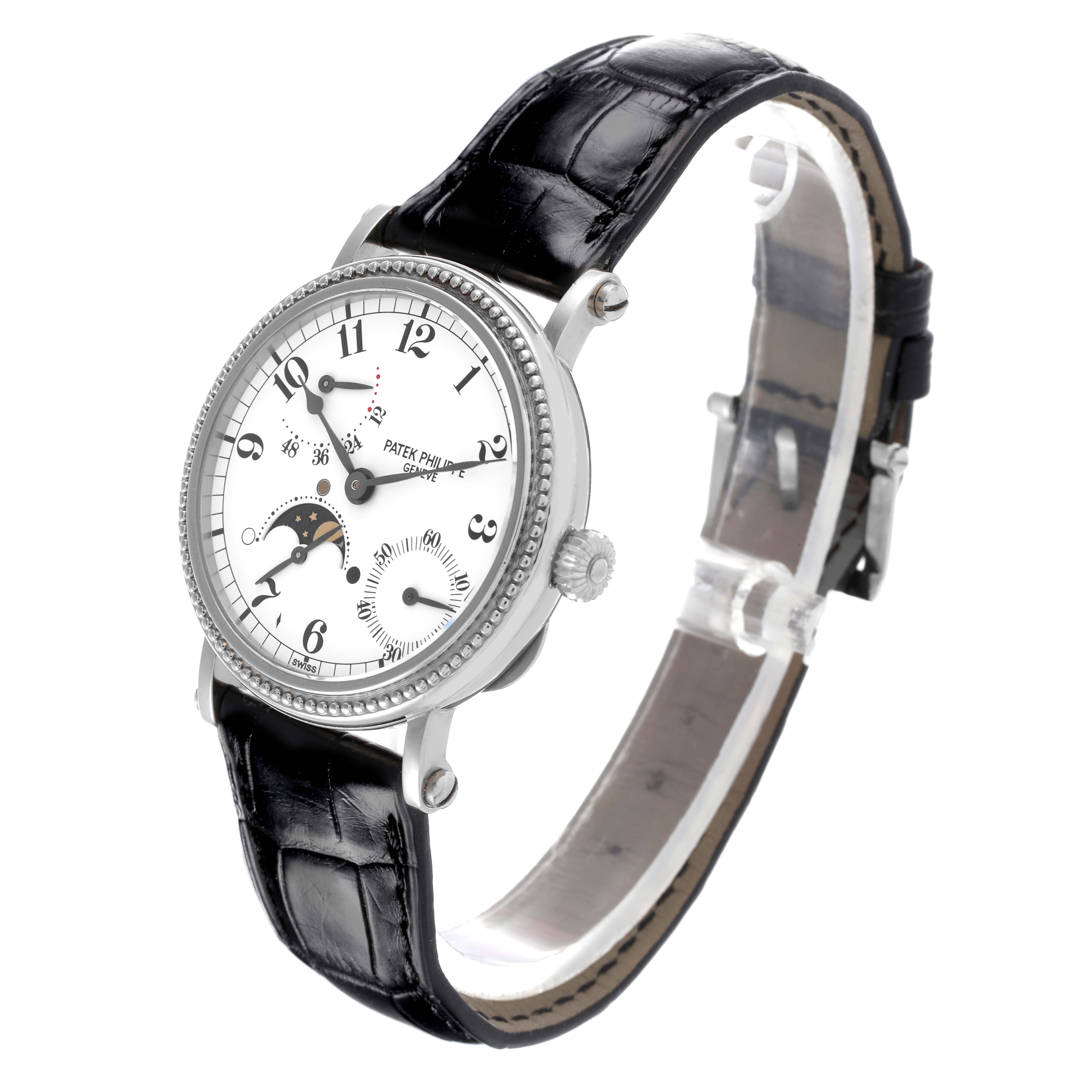 The Patek Philippe Complications 5015G Men's White Gold White Dial 5015G Men's White Gold White Dial watch is shown at a tilted angle, highlighting the face, bezel, lugs, and leather strap.