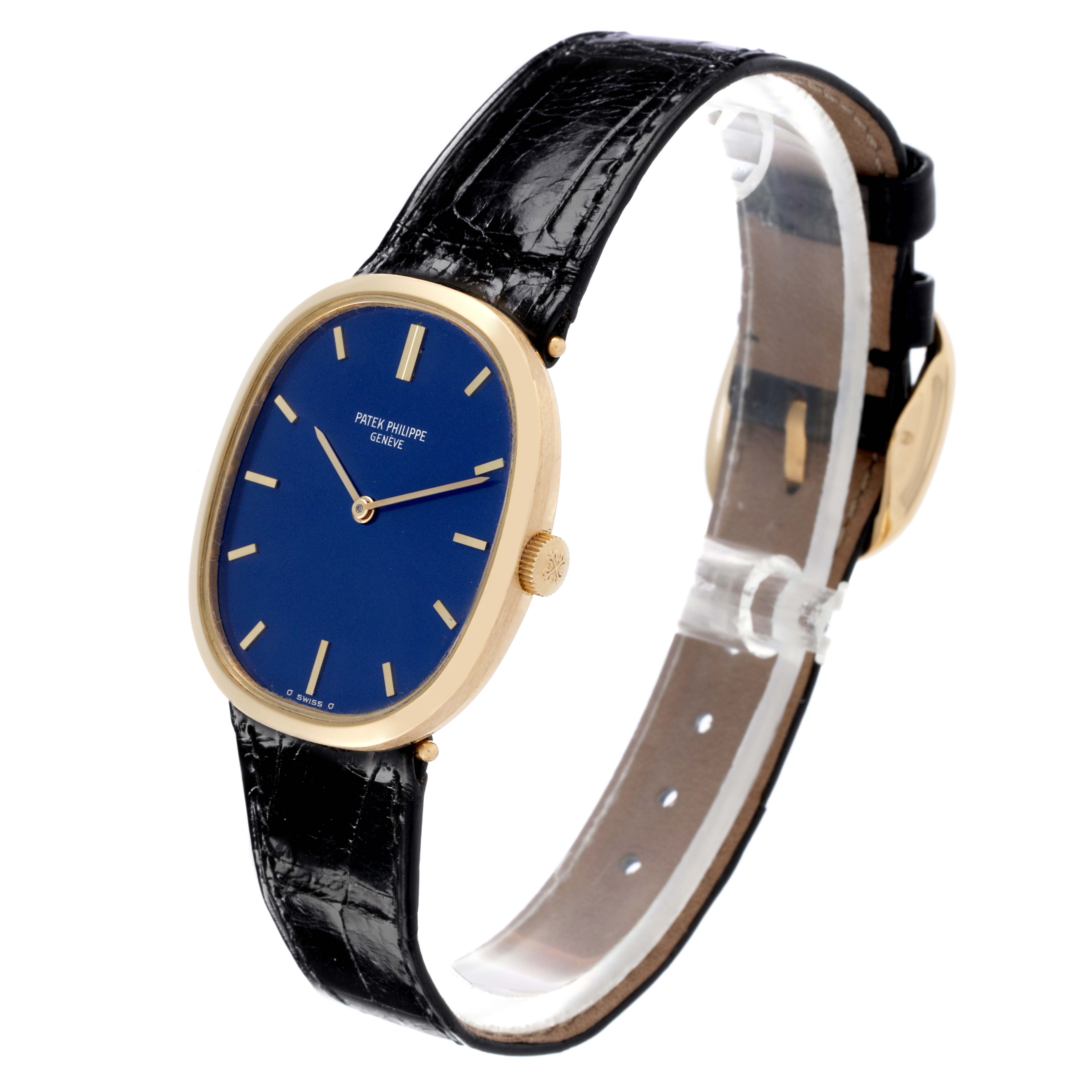 The Patek Philippe Golden Ellipse 3548 Men's Yellow Gold Blue Dial 3548 Men's Yellow Gold Blue Dial watch is shown at an angled side view, displaying the blue dial, gold case, and black strap.