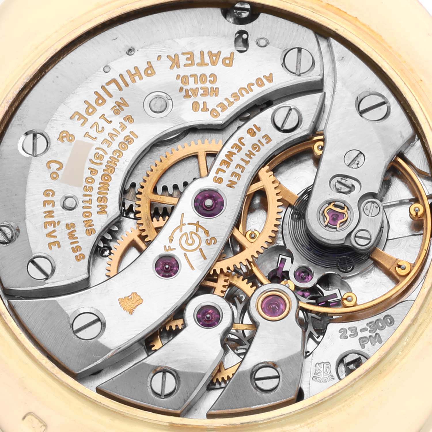 This image shows the intricate movement of the Patek Philippe Golden Ellipse 3548 Men's Yellow Gold Blue Dial 3548 Men's Yellow Gold Blue Dial watch from a rear view angle, revealing gears and engravings.