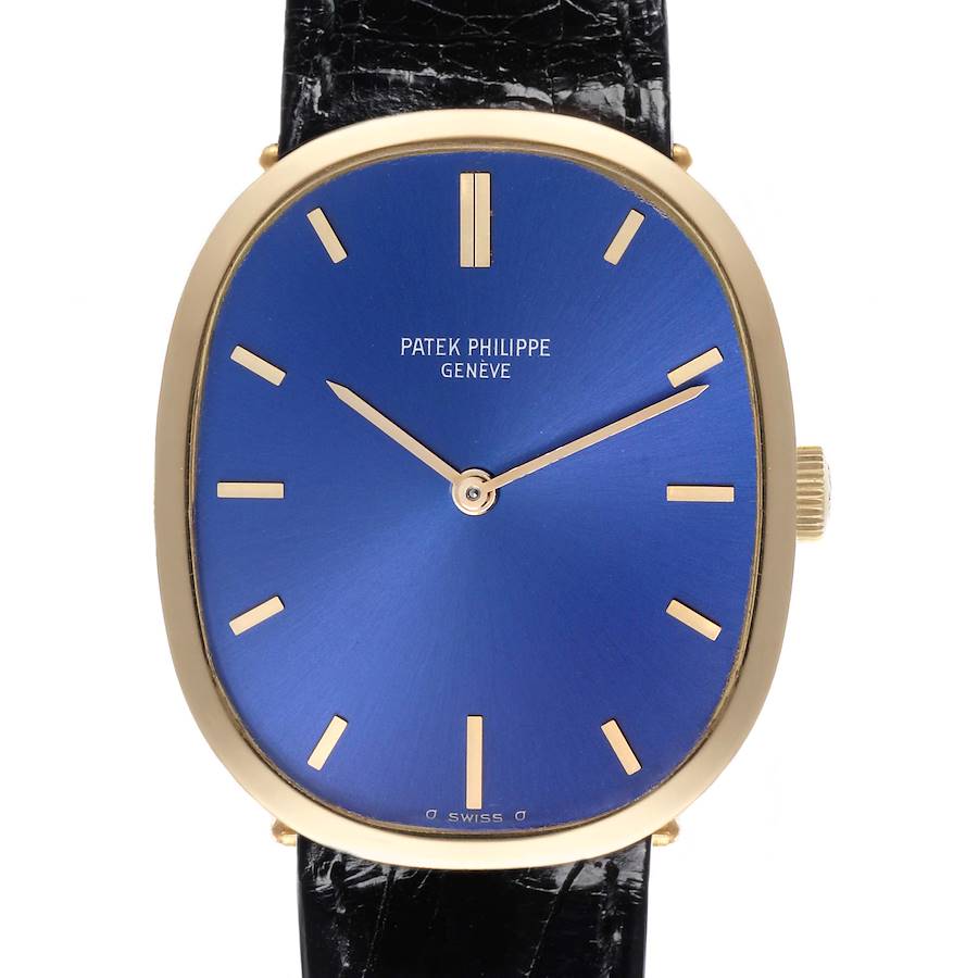 The Patek Philippe Golden Ellipse watch is shown from the front, highlighting the blue dial and gold case.