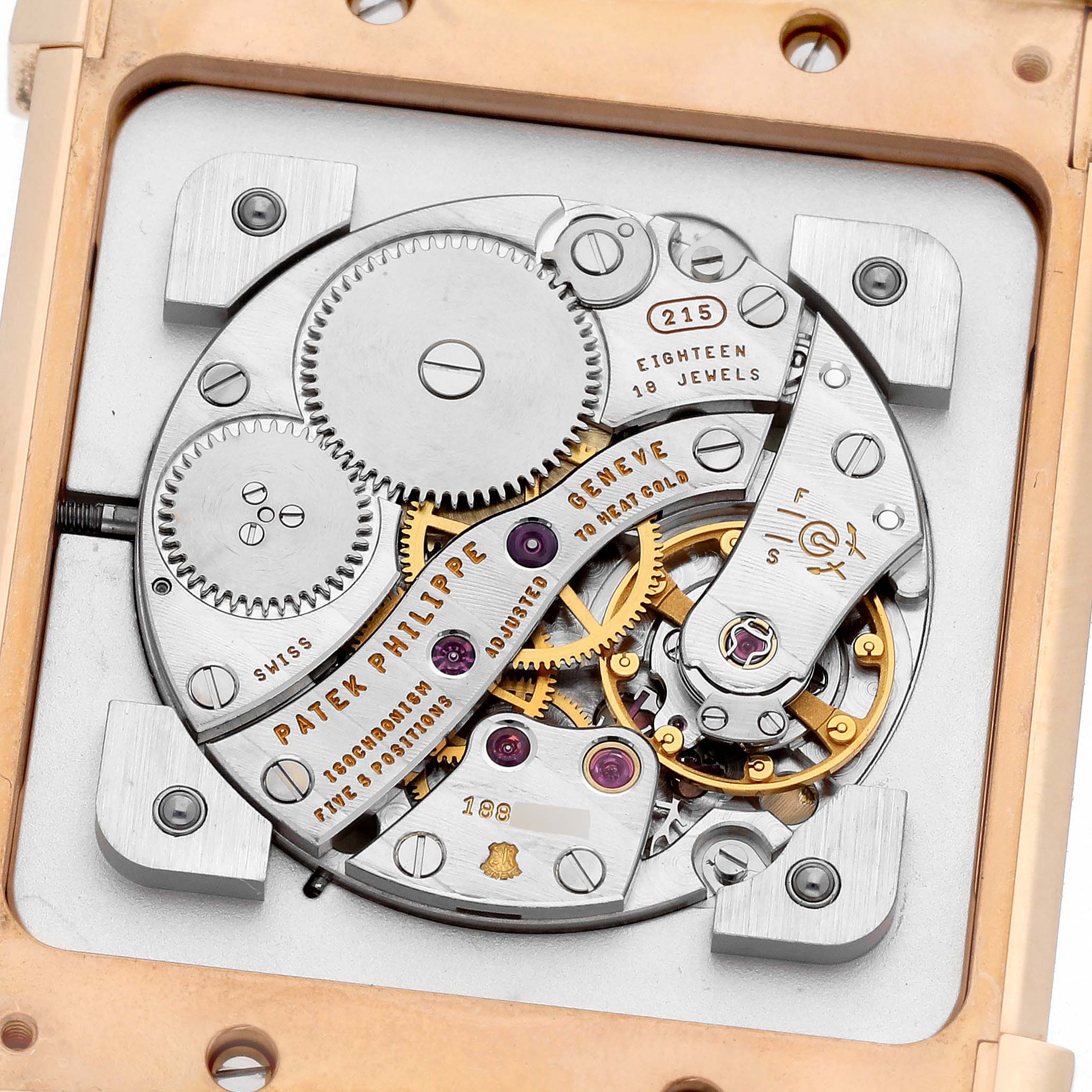 The image shows a close-up of the Patek Philippe Gondolo 5111R-001 Men's Rose Gold Silver Dial 5111R-001 Men's Rose Gold Silver Dial watch movement with gears and jewels visible.
