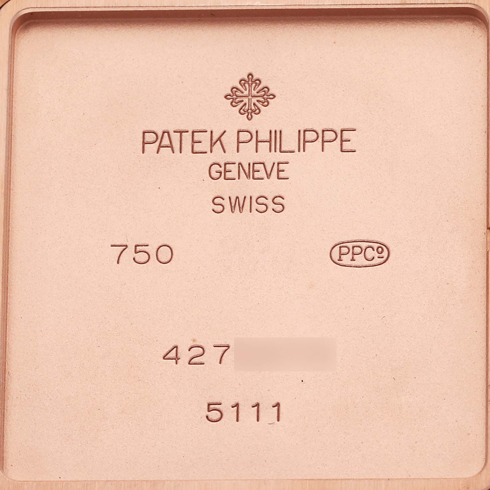 The image shows the back plate of a Patek Philippe Gondolo 5111R-001 Men's Rose Gold Silver Dial 5111R-001 Men's Rose Gold Silver Dial, displaying the brand engravings and model number.