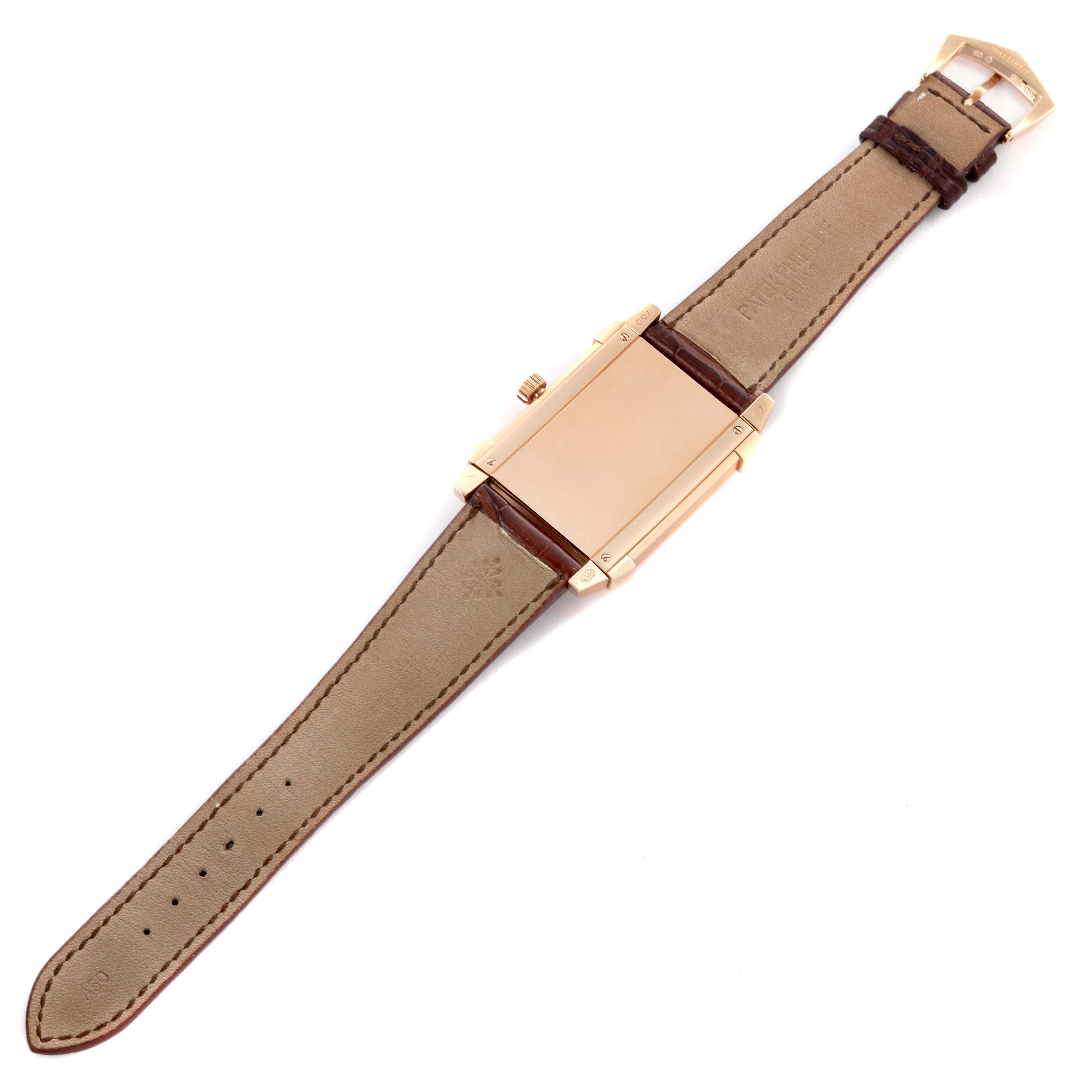 The Patek Philippe Gondolo 5111R-001 Men's Rose Gold Silver Dial 5111R-001 Men's Rose Gold Silver Dial watch is shown from the back, displaying its case, brown leather strap, and buckle.