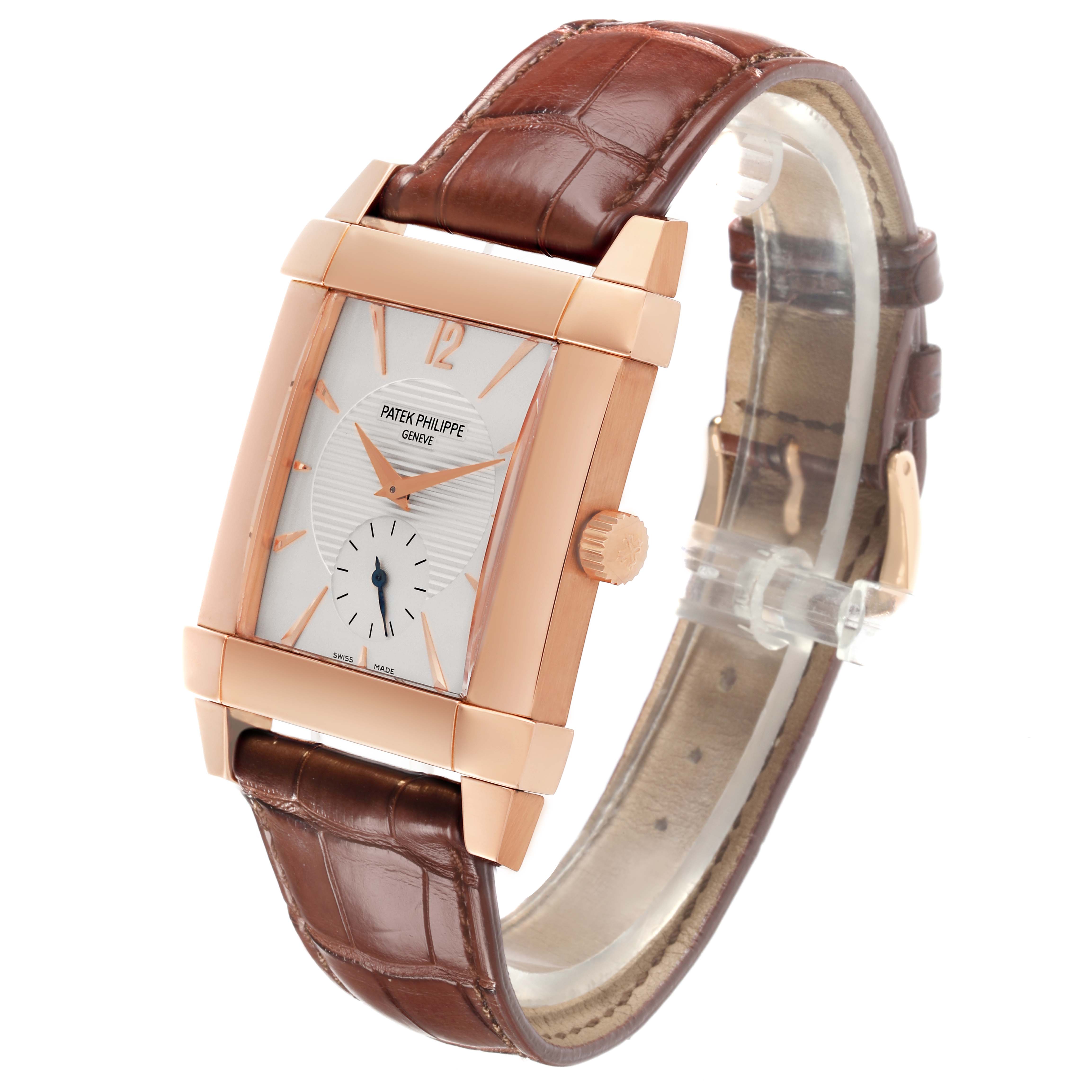 The Patek Philippe Gondolo 5111R-001 Men's Rose Gold Silver Dial 5111R-001 Men's Rose Gold Silver Dial watch is shown at a three-quarter angle, highlighting its rectangular case, dial, crown, and leather strap.