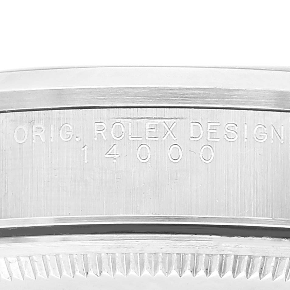 This close-up image shows the engraved caseback of the Rolex 14000 Men's Stainless Steel Blue Dial 14000 Men's Stainless Steel Blue Dial Air King 14000 model.