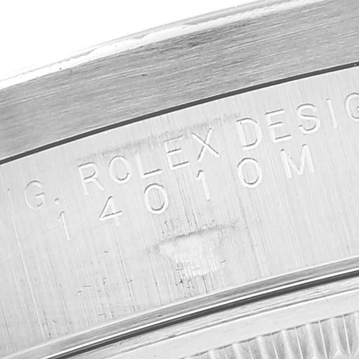 This is a close-up image of the Air-King Rolex model showing the engraved model number and "Rolex Design" marking.