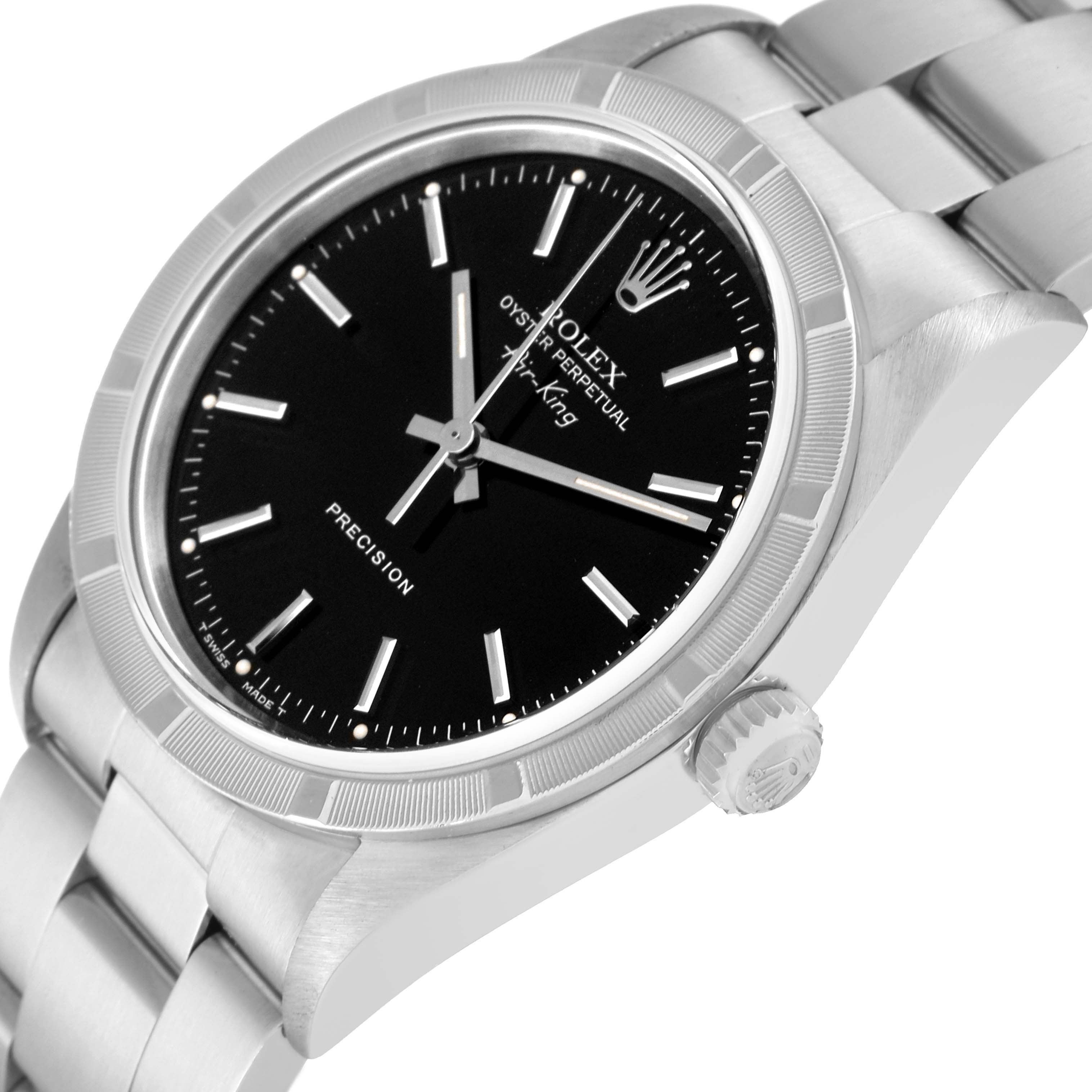 The image shows a side angle of the Rolex Air-King 14010 Men's Stainless Steel Black Dial 14010 Men's Stainless Steel Black Dial watch featuring its face, bezel, crown, and part of the bracelet.