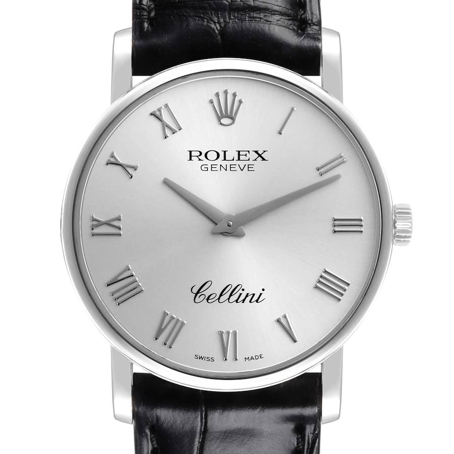 The Rolex Cellini is shown from a frontal angle, displaying the dial, hands, crown, and part of the black leather strap.