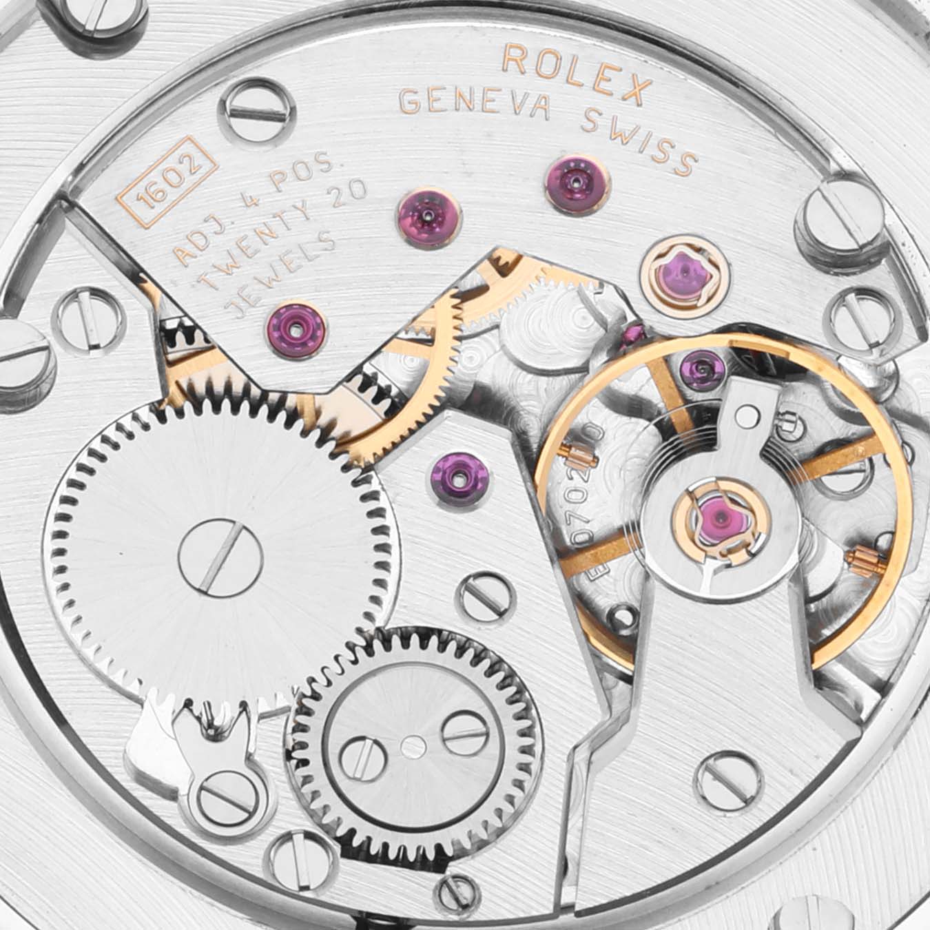 The image shows a close-up of the Rolex Cellini 5115/9 Men's White Gold Silver Dial 5115/9 Men's White Gold Silver Dial watch movement, highlighting gears and jewels.
