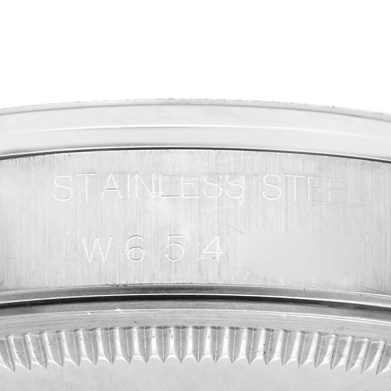 The image shows the edge of the Rolex Date 15200 Men's Stainless Steel White Dial 15200 Men's Stainless Steel White Dial watch, focusing on the stainless steel case and engraved markings.