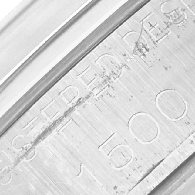 The image shows a close-up of the engraved inner bezel of a Rolex Vintage Collection 1500 Men's Stainless Steel Silver Dial 1500 Men's Stainless Steel Silver Dial watch.