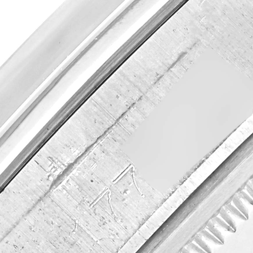 The image shows a close-up of the side casing or bezel edge of the Rolex Vintage Collection 1500 Men's Stainless Steel Silver Dial 1500 Men's Stainless Steel Silver Dial watch.