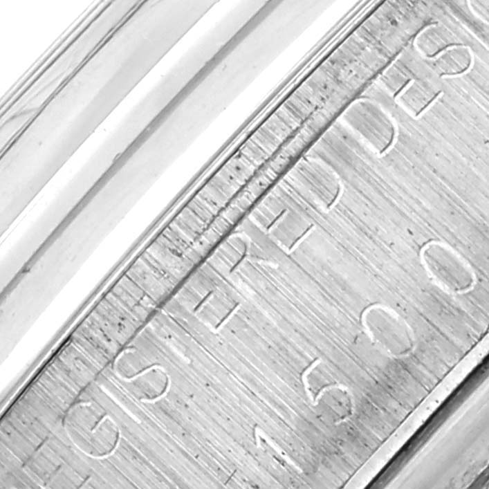 The image shows a close-up of the engraved edge on the Rolex Vintage Collection 15000 Men's Stainless Steel Silver Dial 15000 Men's Stainless Steel Silver Dial watch.