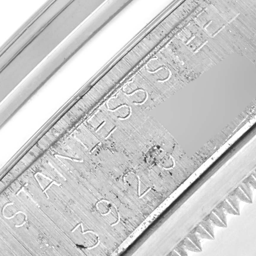The image shows a close-up of the side of the Vintage Collection by Rolex, focusing on engraved markings.