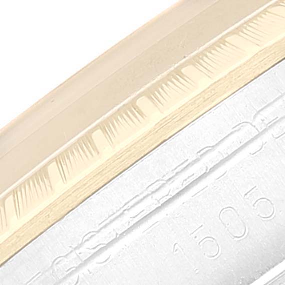 The image shows a close-up of the bezel and part of the case of a Vintage Collection model by Rolex.