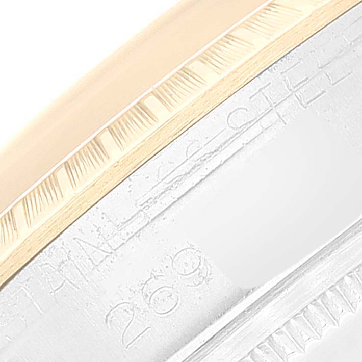 This close-up photograph displays the side of the bezel and part of the case back of a Rolex Vintage Collection 1505 Men's Steel and Gold (two tone) Champagne Dial 1505 Men's Steel and Gold (two tone) Champagne Dial watch.