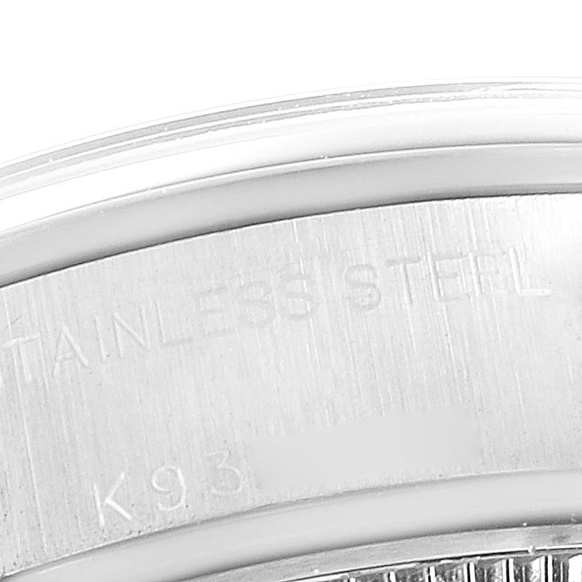 The image shows a close-up of the stainless steel case back of a Rolex Date 79160 Women
s Stainless Steel White Dial 79160 Women
s Stainless Steel White Dial model watch.