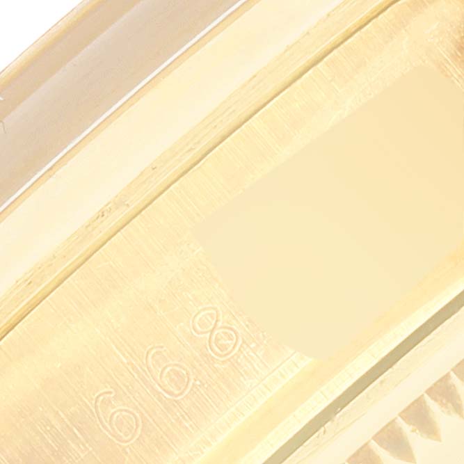 This is a close-up angle focusing on the inner markings of the Rolex Vintage Collection 15007 Men's Yellow Gold Champagne Dial 15007 Men's Yellow Gold Champagne Dial model watch bezel.