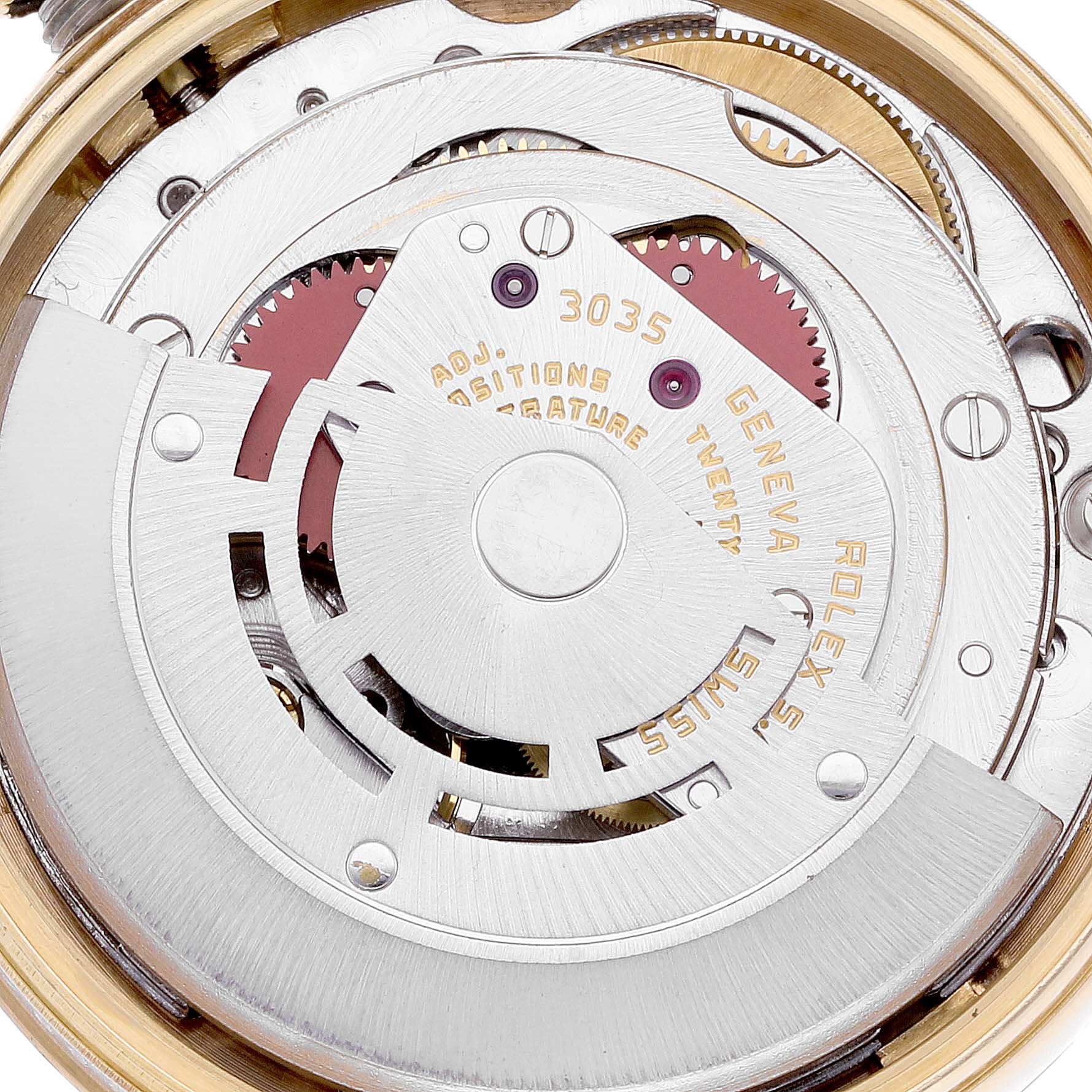 Close-up view of the movement and internal mechanics of a Vintage Collection Rolex watch, showing gears and inscriptions.