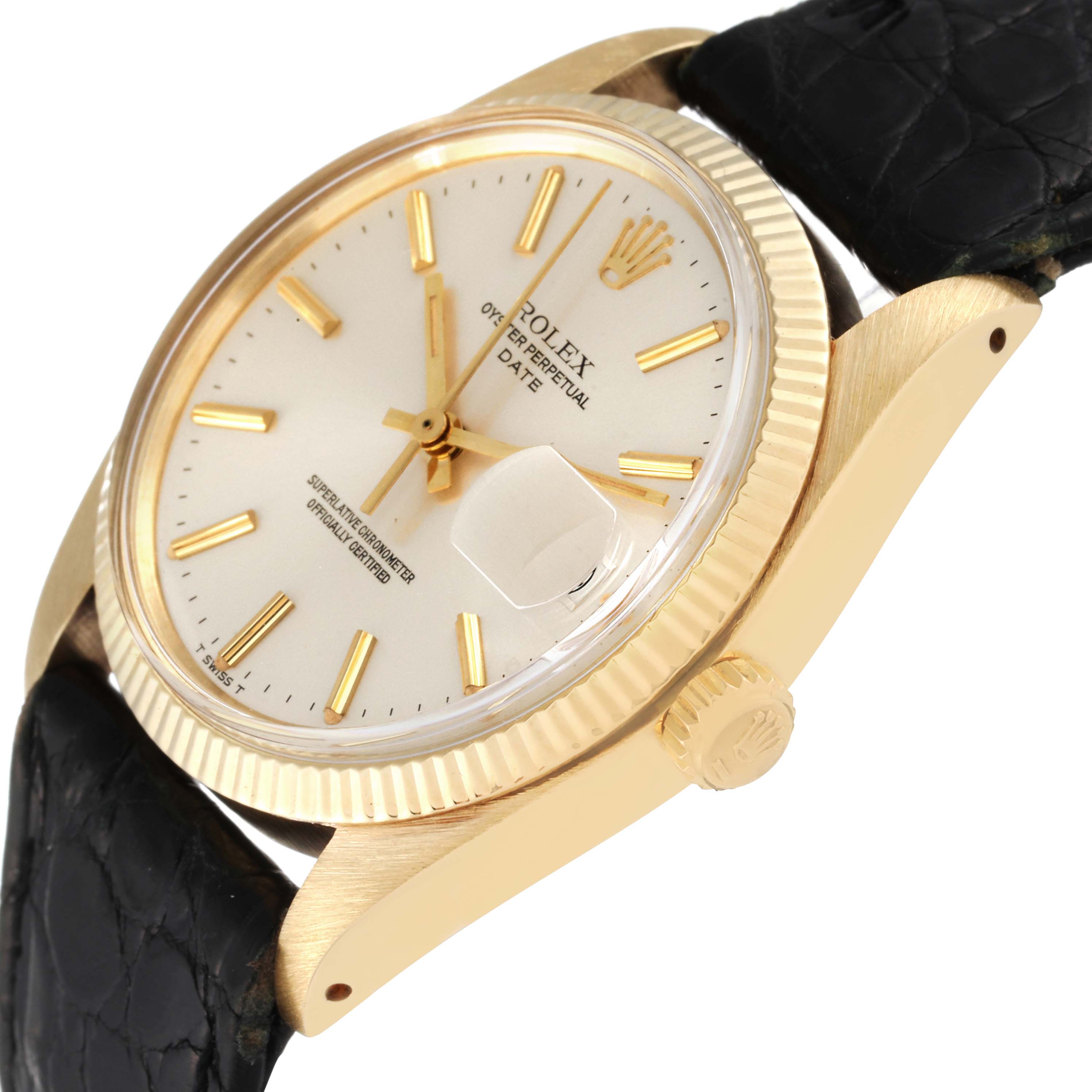 The image shows the face, bezel, crown, and part of the leather strap of a Vintage Collection model by Rolex at an angled view.