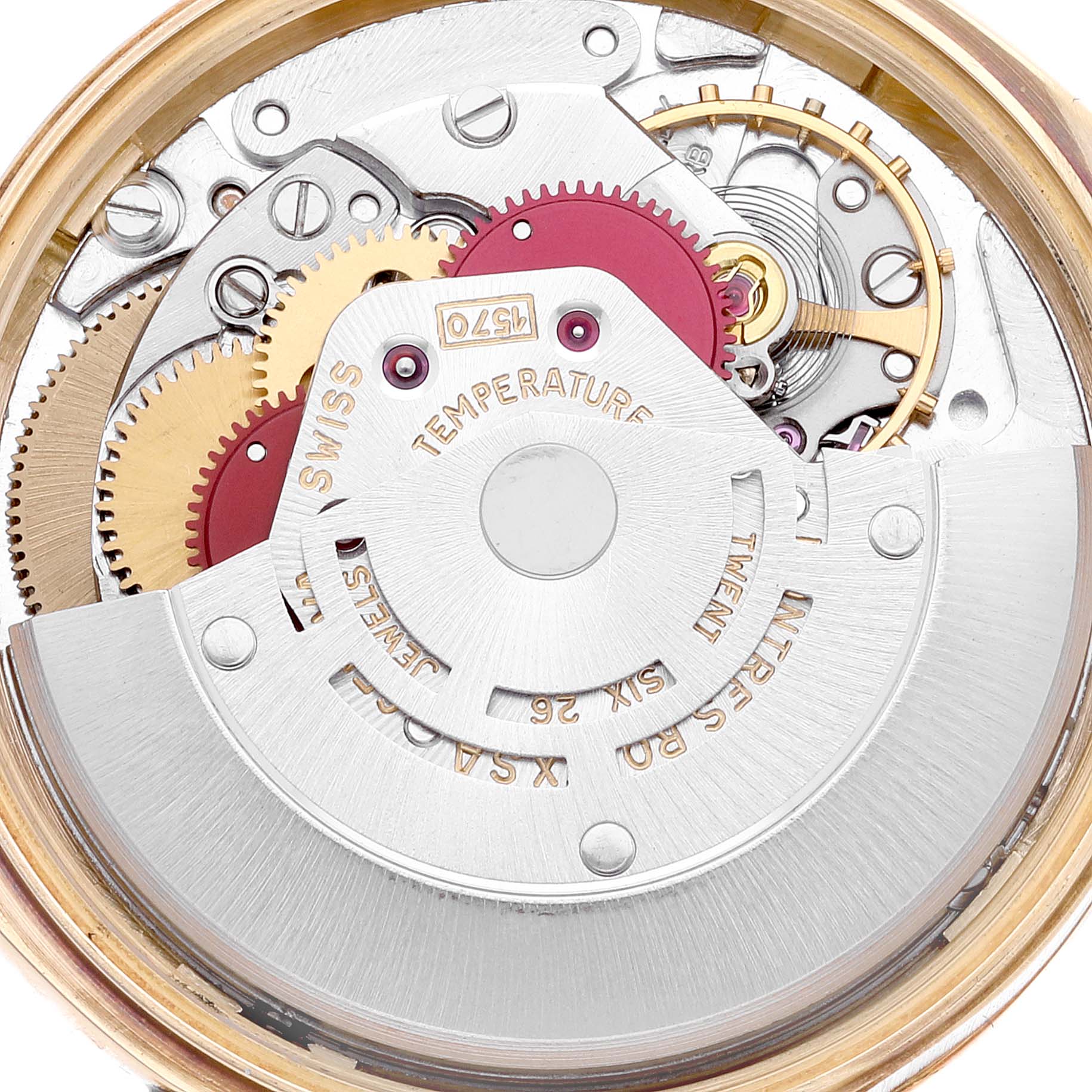 The image shows a close-up of the internal movement and gears of a Vintage Collection model watch by Rolex.
