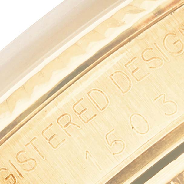 This close-up image shows the engraved details on the side of the bezel or case of a Vintage Collection Rolex watch.