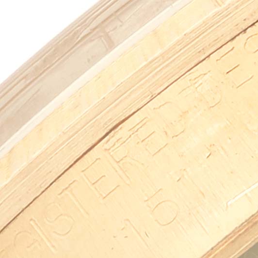 This is a close-up angle of the engraving on the case back of a Rolex Vintage Collection 1511 Men's Yellow Gold Champagne Dial 1511 Men's Yellow Gold Champagne Dial model watch.