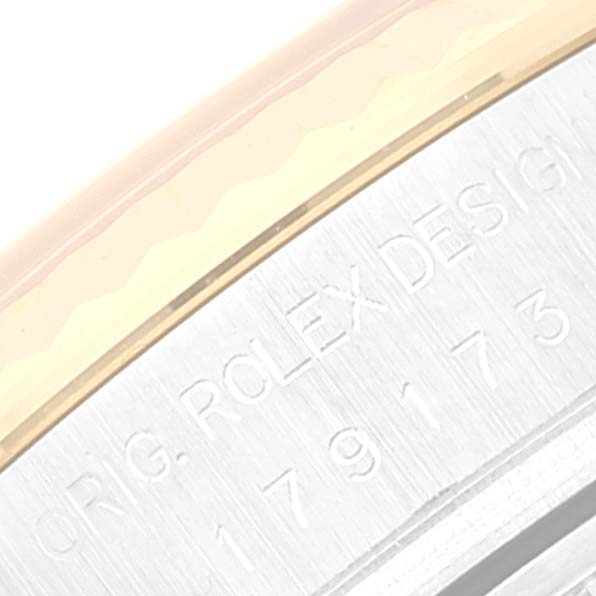 This is a close-up angle showing the engraving on the side of a Rolex Datejust 179173 Women's Steel and Gold (two tone) Blue Dial 179173 Women's Steel and Gold (two tone) Blue Dial watch case.