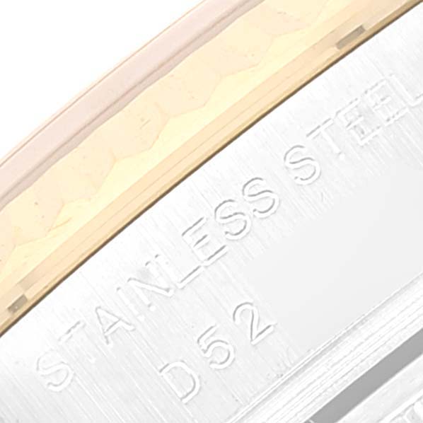 This close-up image shows part of the stainless steel casing of a Rolex Datejust 179173 Women's Steel and Gold (two tone) Blue Dial 179173 Women's Steel and Gold (two tone) Blue Dial watch.