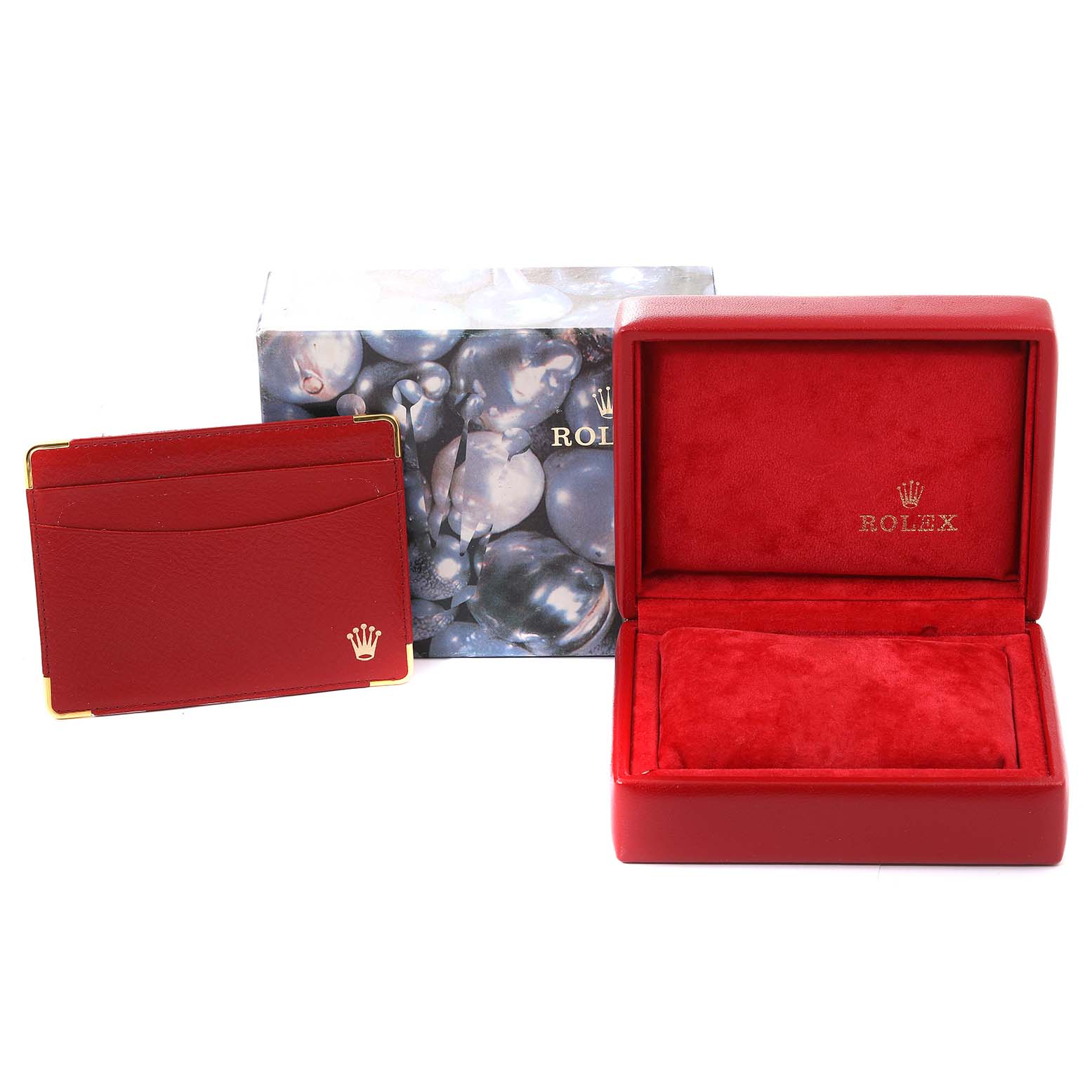 This image shows a red Rolex Datejust 79173 Women's Steel and Gold (two tone) White Dial 79173 Women's Steel and Gold (two tone) White Dial watch box, a matching card holder, and the outer packaging.