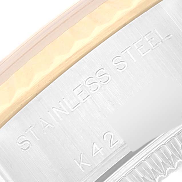 The image shows a close-up of the side of a Rolex Datejust 79173 Women's Steel and Gold (two tone) White Dial 79173 Women's Steel and Gold (two tone) White Dial watch with the "STAINLESS STEEL" engraving.