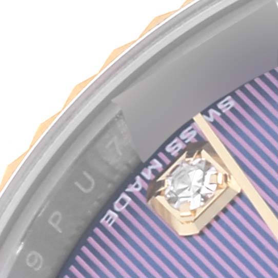 This close-up shows the dial, diamond hour marker, and part of the bezel of the Rolex Datejust 279173 Women's Steel and Gold (two tone) Purple Dial 279173 Women's Steel and Gold (two tone) Purple Dial watch.