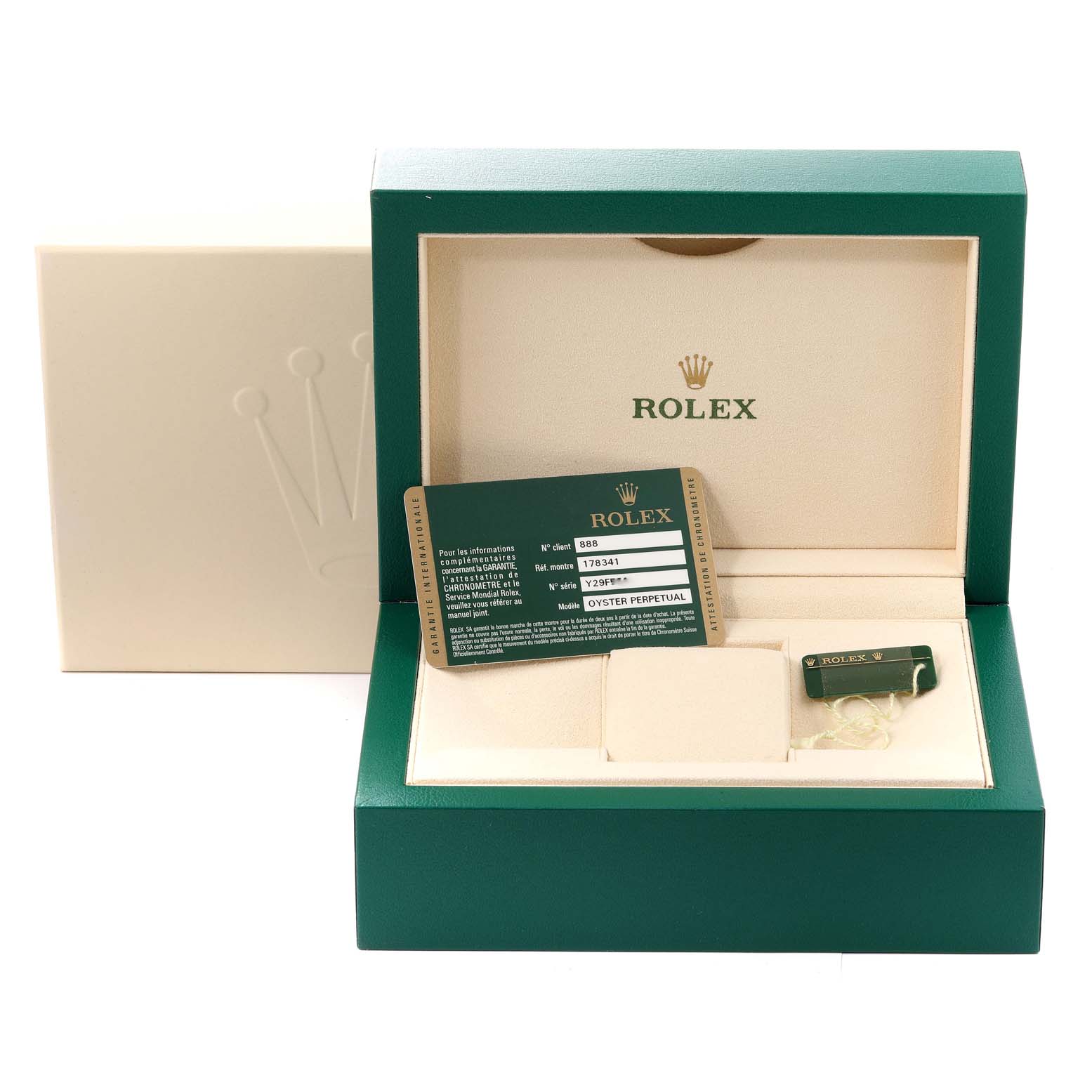 The image shows a green Rolex watch box for a Mid-Size model, with a card and tag inside.