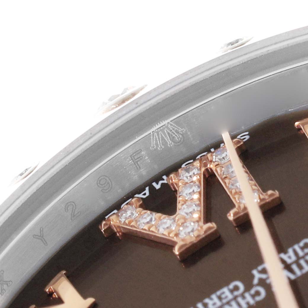 This close-up angle shows the dial, bezel, and part of the engraved inner rim of the Rolex Mid-Size 178341 Women's Steel and Gold (two tone) Brown Dial 178341 Women's Steel and Gold (two tone) Brown Dial model watch.